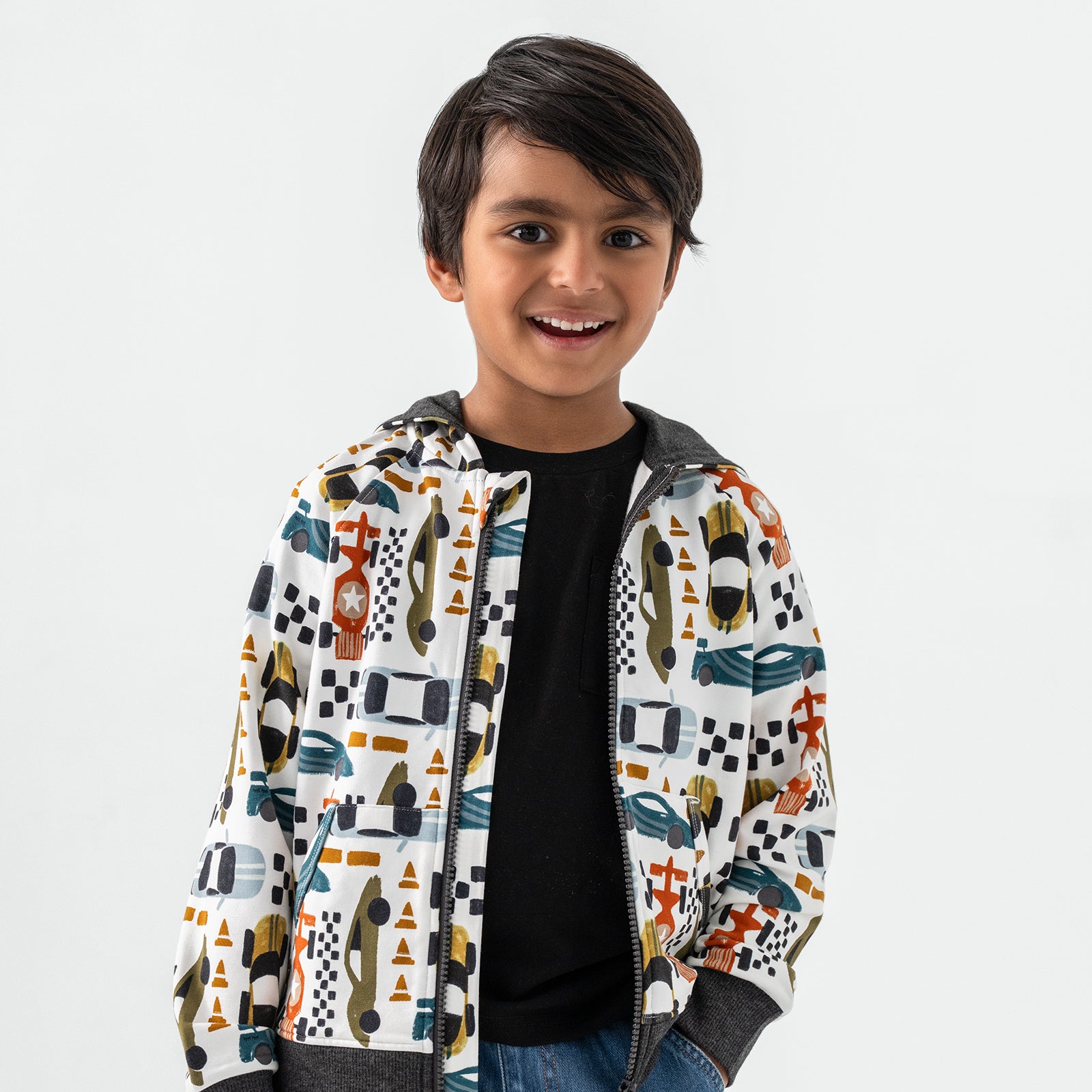 Standing chid wearing the Fast Lane Zip Hoodie over a black short sleeve bamboo tee