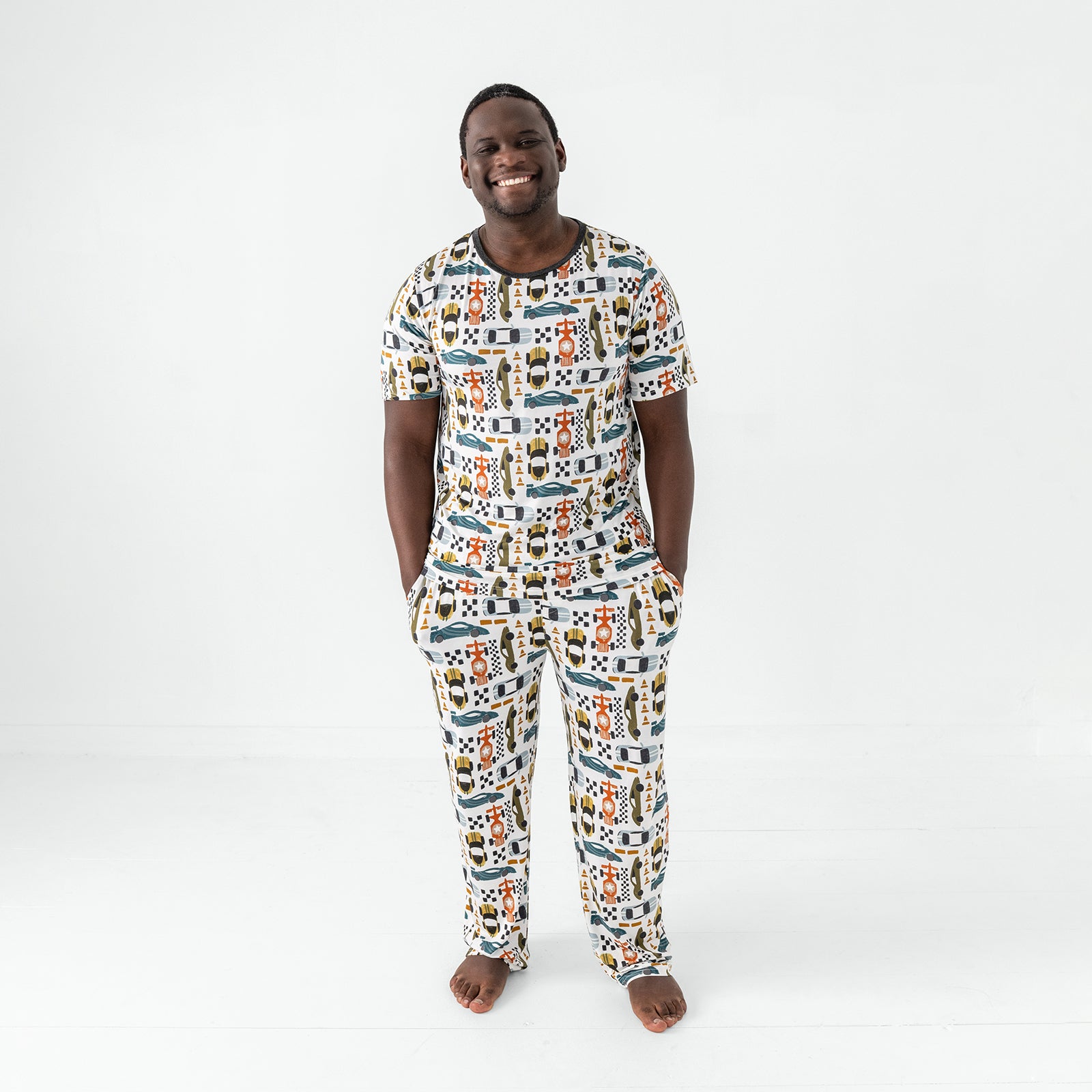 Standing man wearing the Fast Lane Men's Pajama Pants and matching bamboo pajama top