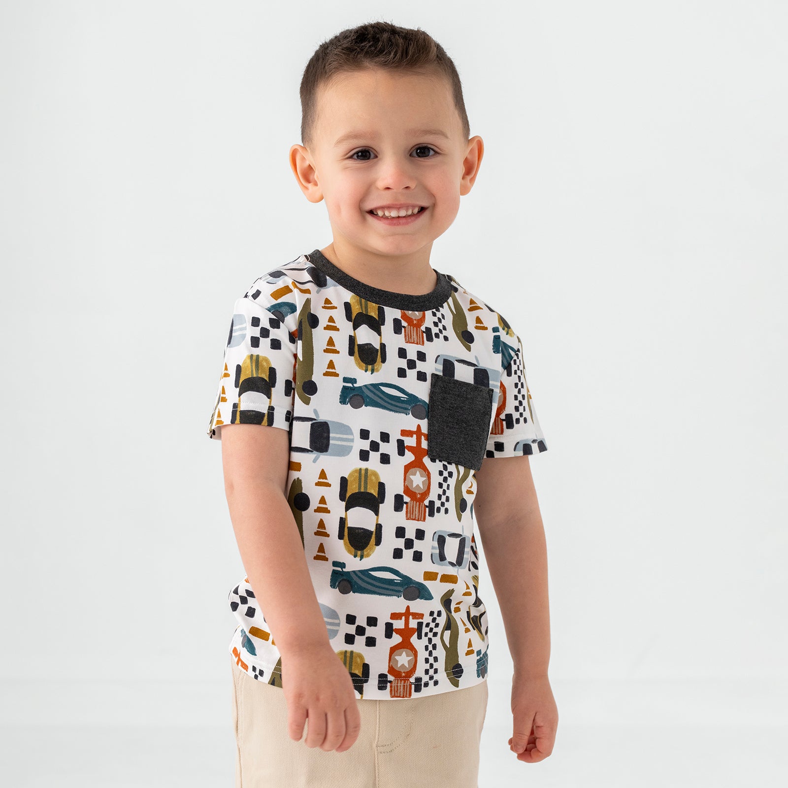 Standing boy wearing the Fast Lane Short Sleeve Relaxed Pocket Tee