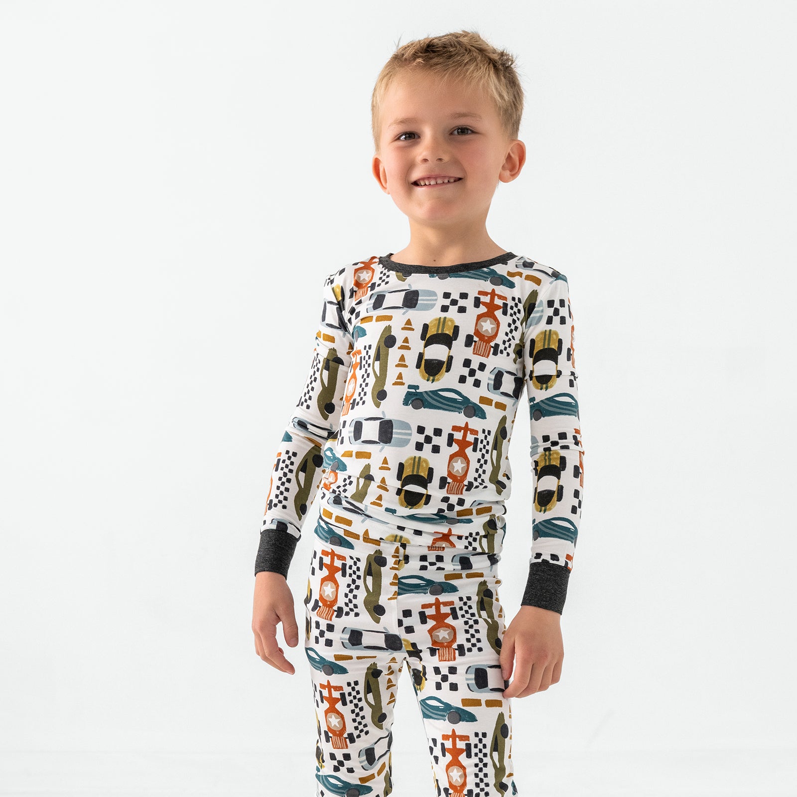 Standing child wearing the Fast Lane Two-Piece Pajama Set