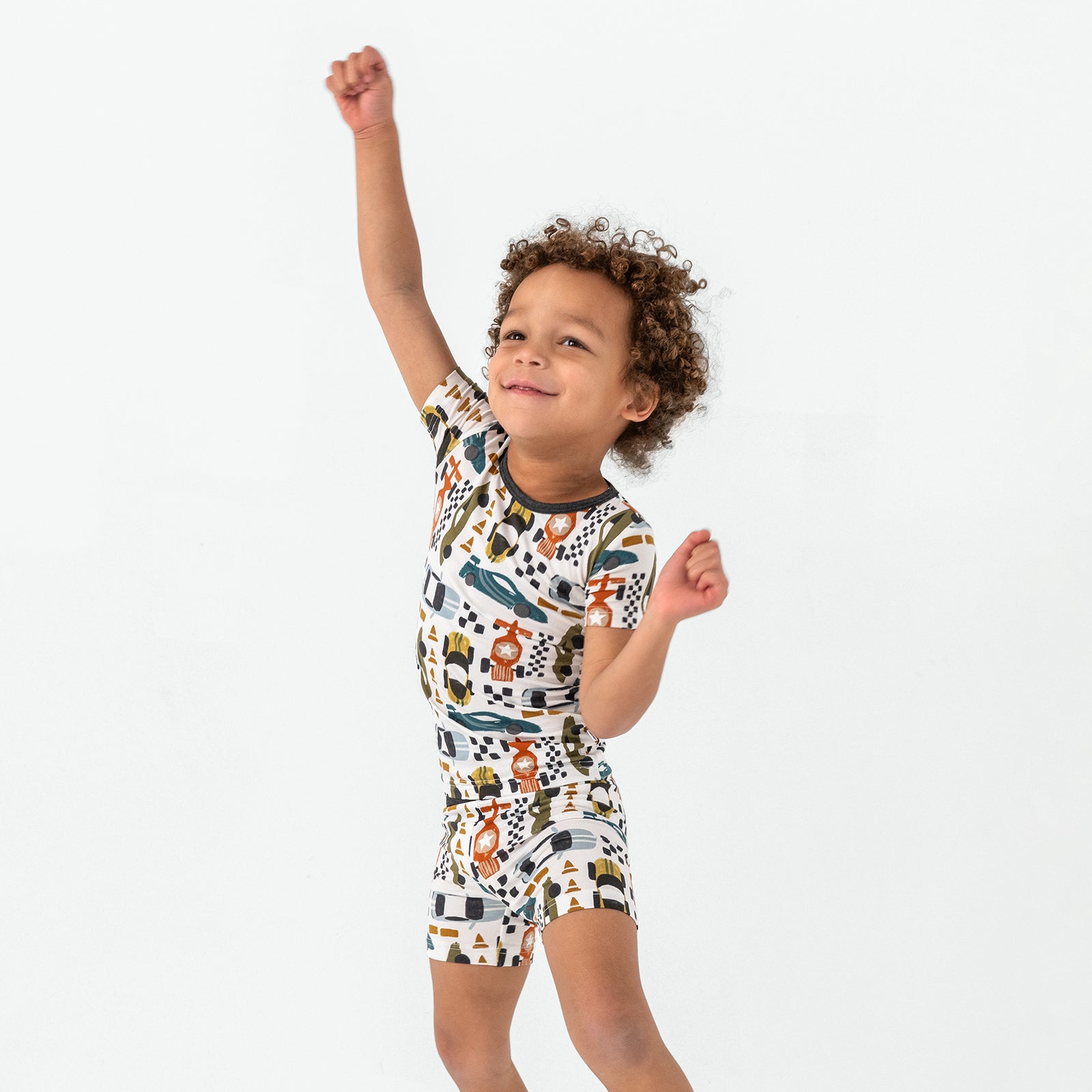 Dancing child wearing the Fast Lane Two-Piece Short Sleeve & Shorts Pajama Set