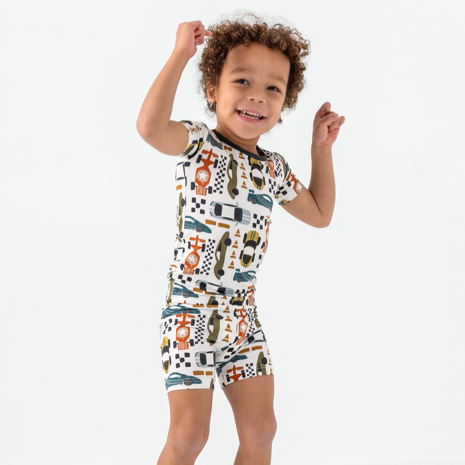Posing child wearing the Fast Lane Two-Piece Pajama Set