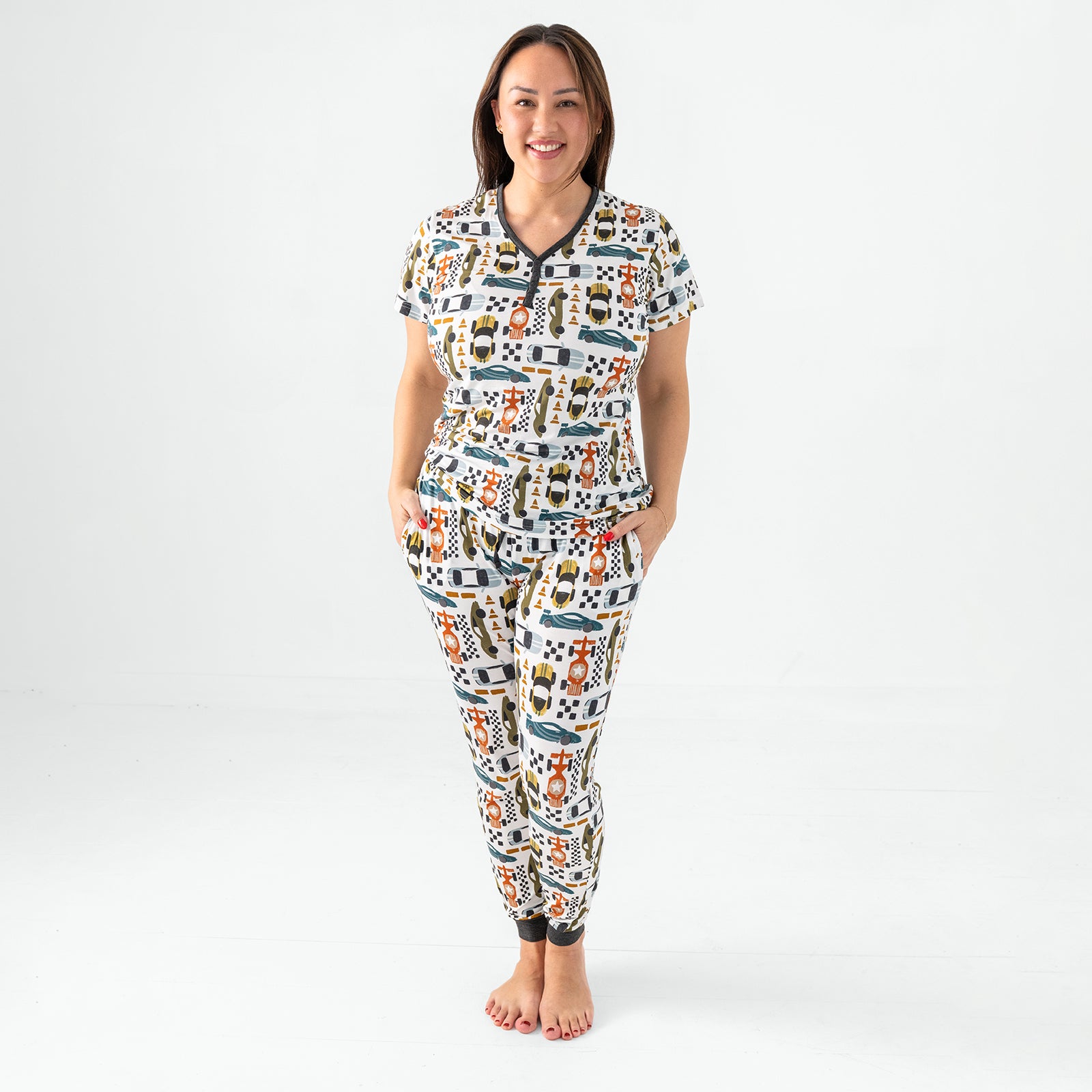 Standing woman wearing the Fast Lane Women's Short Sleeve Pajama Top and matching pajama pants