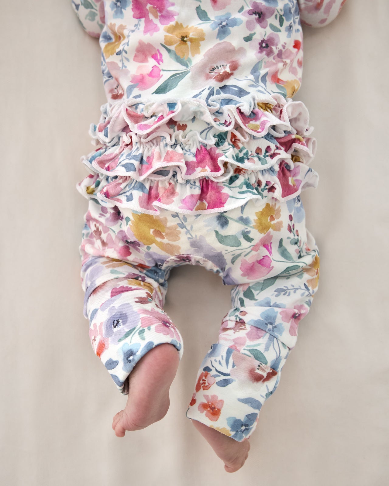 Close up of the ruffle detail on the Tiny Blooms Ruffle Zippy