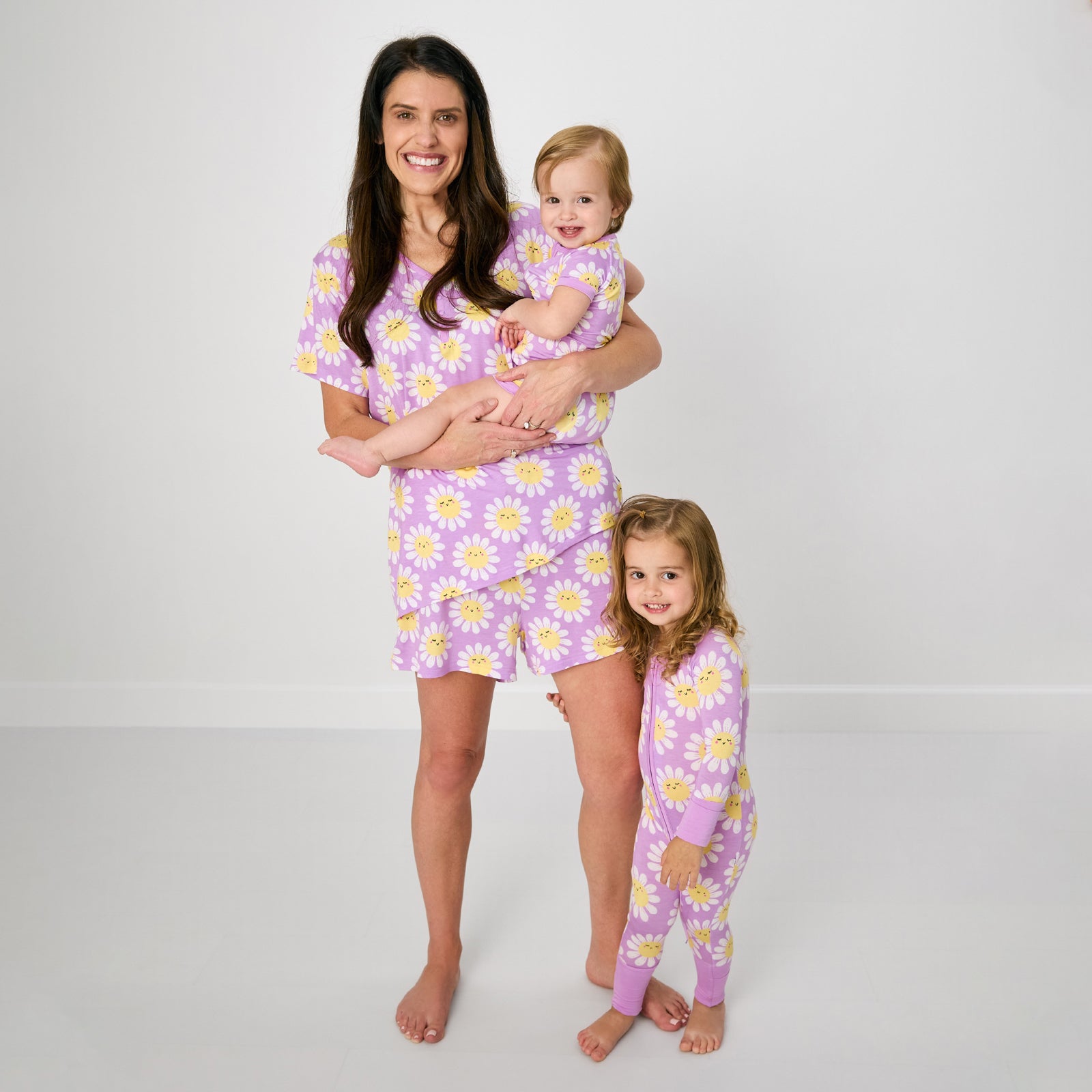 Mother and two children wearing matching Flower Power pajamas