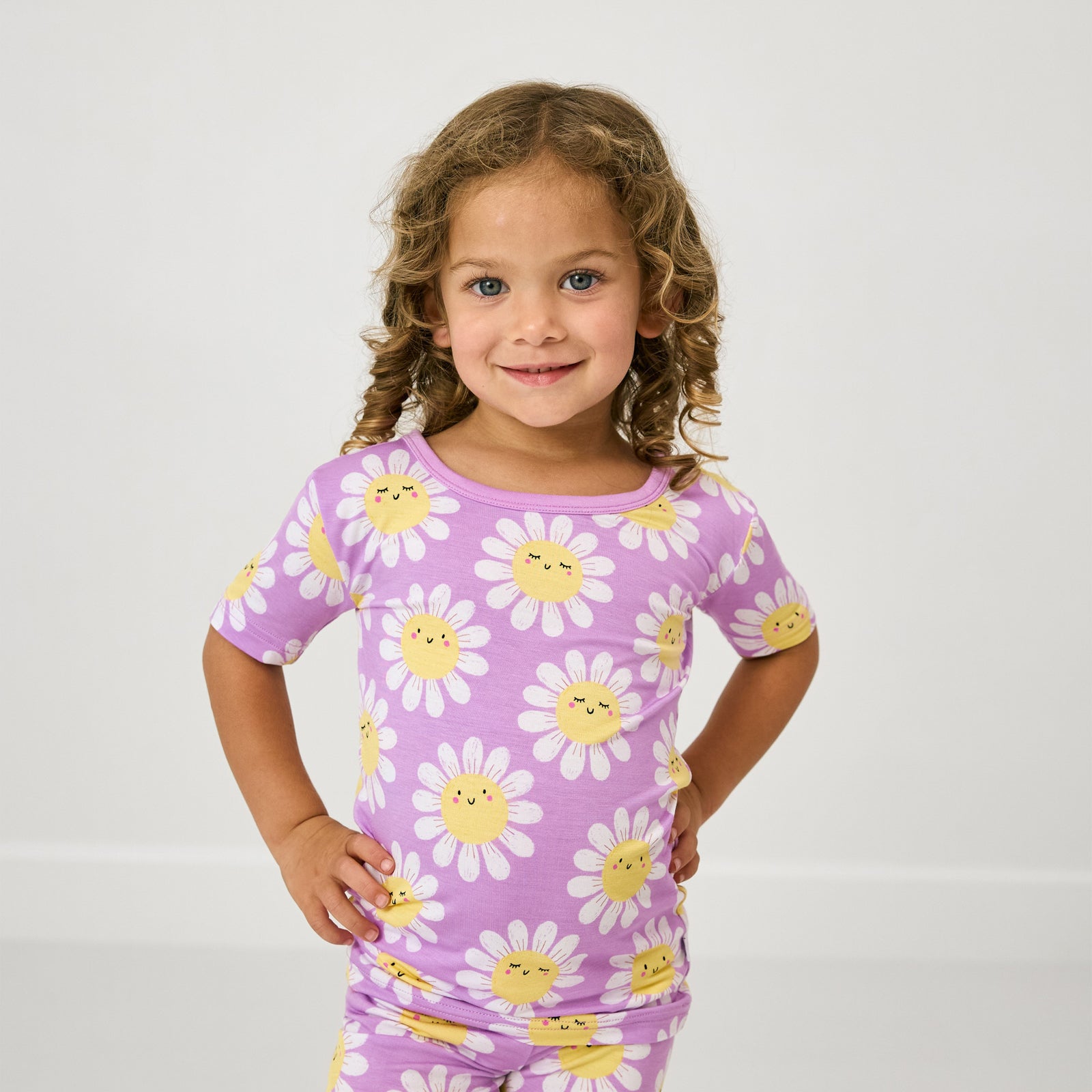 Close up of child wearing the Flower Power Two-Piece Short Sleeve & Shorts Pajama Set