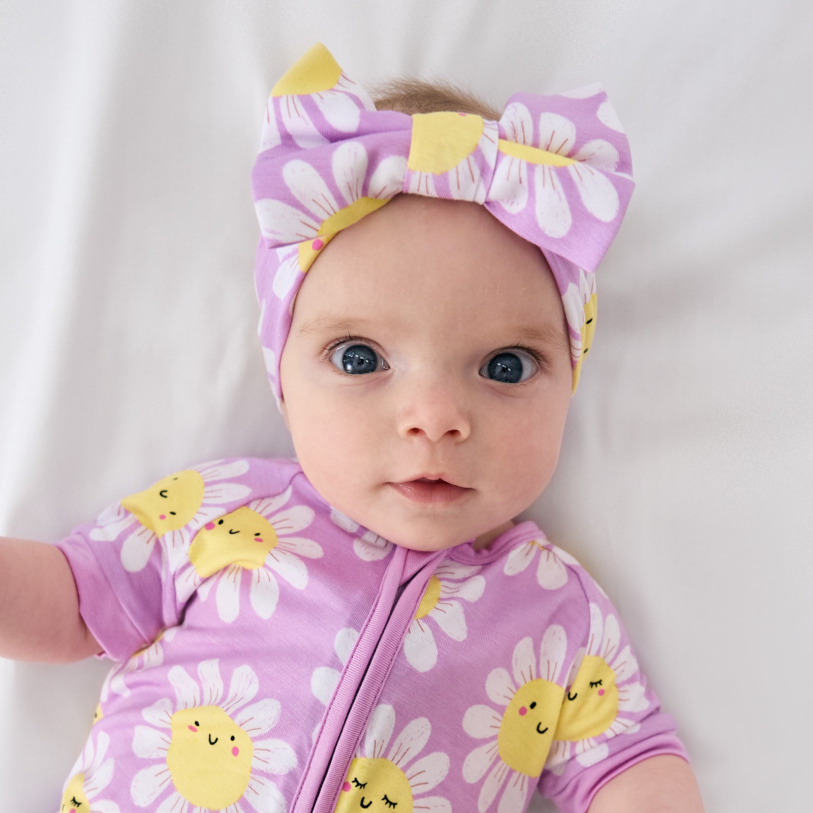 Aerial view of child wearing the Flower Power Luxe Bow Headband