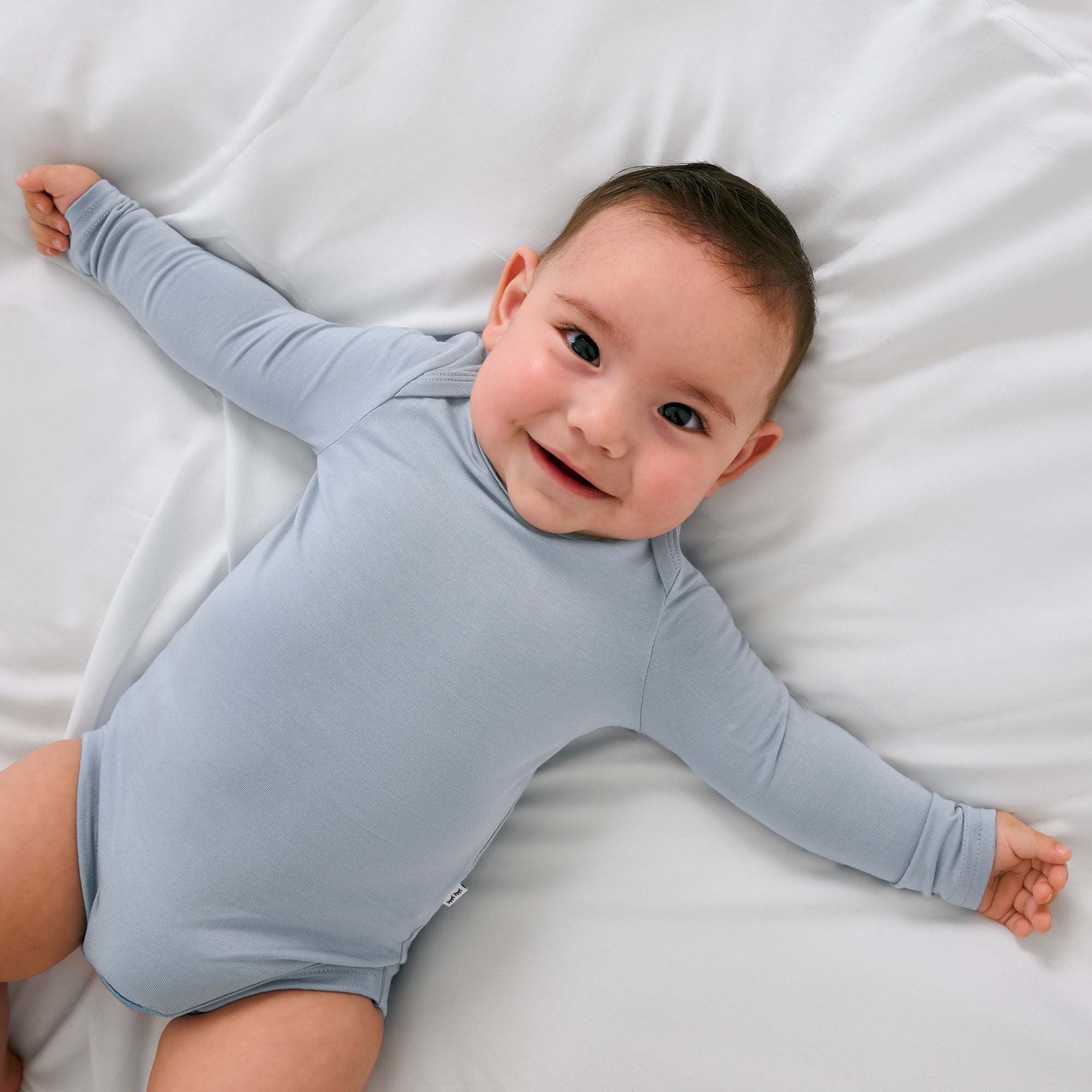 Alternate aerial view of child wearing the Fog Long Sleeve Bodysuit