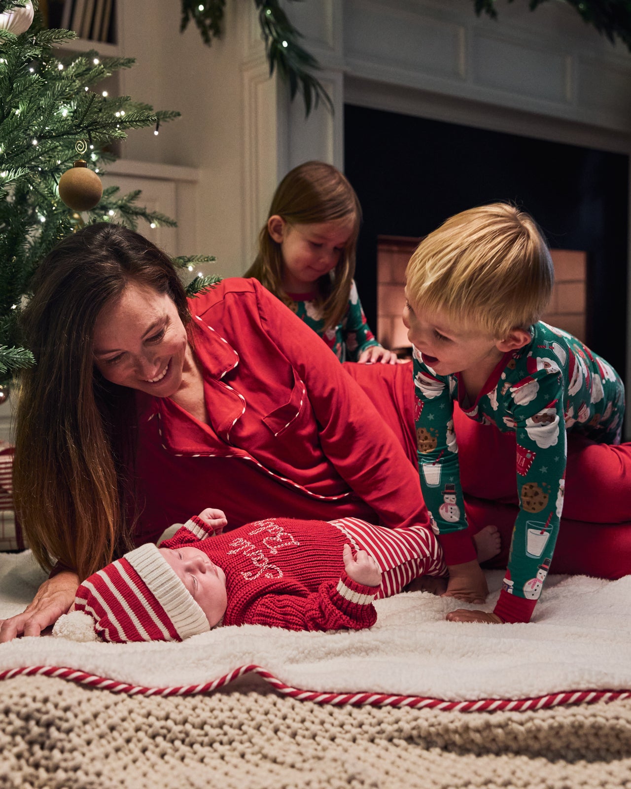 Family of four wearing styles from the Holiday Collection
