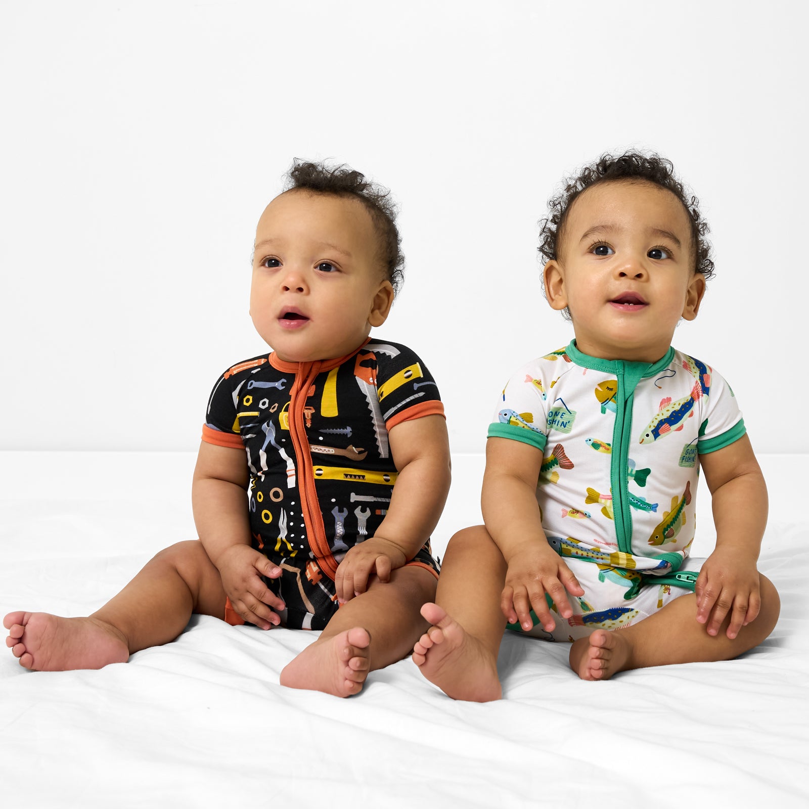 Two children wearing Little Builders and Gone Fishin' shorty zippys