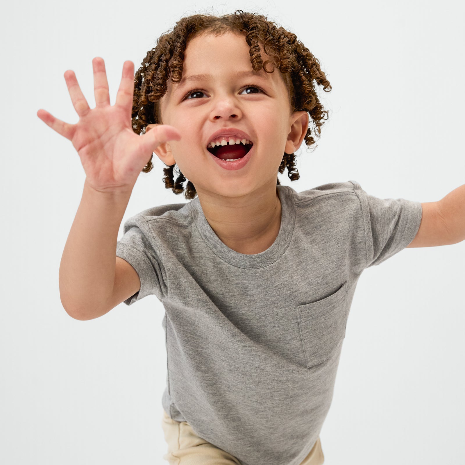 Posing child wearing the Heather Gray Relaxed Pocket Tee