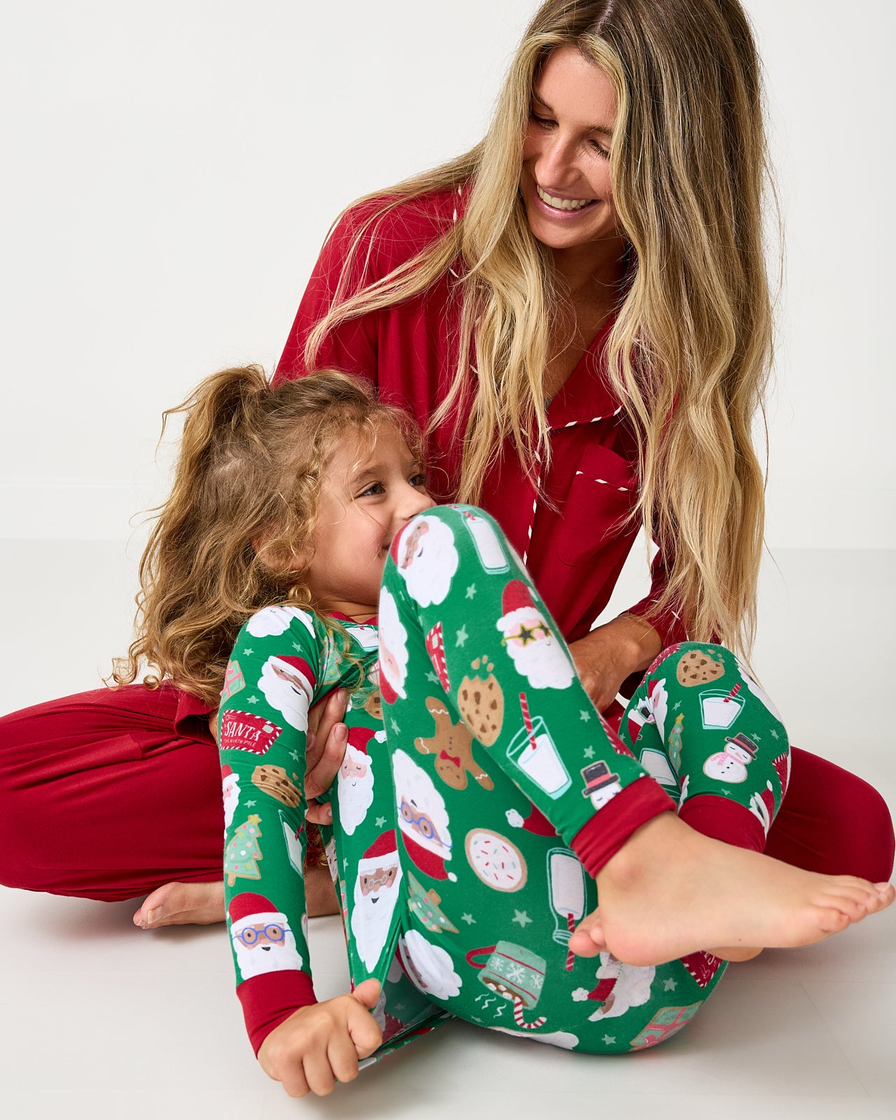 Mother and daughter wearing pajamas from the Holiday Collection