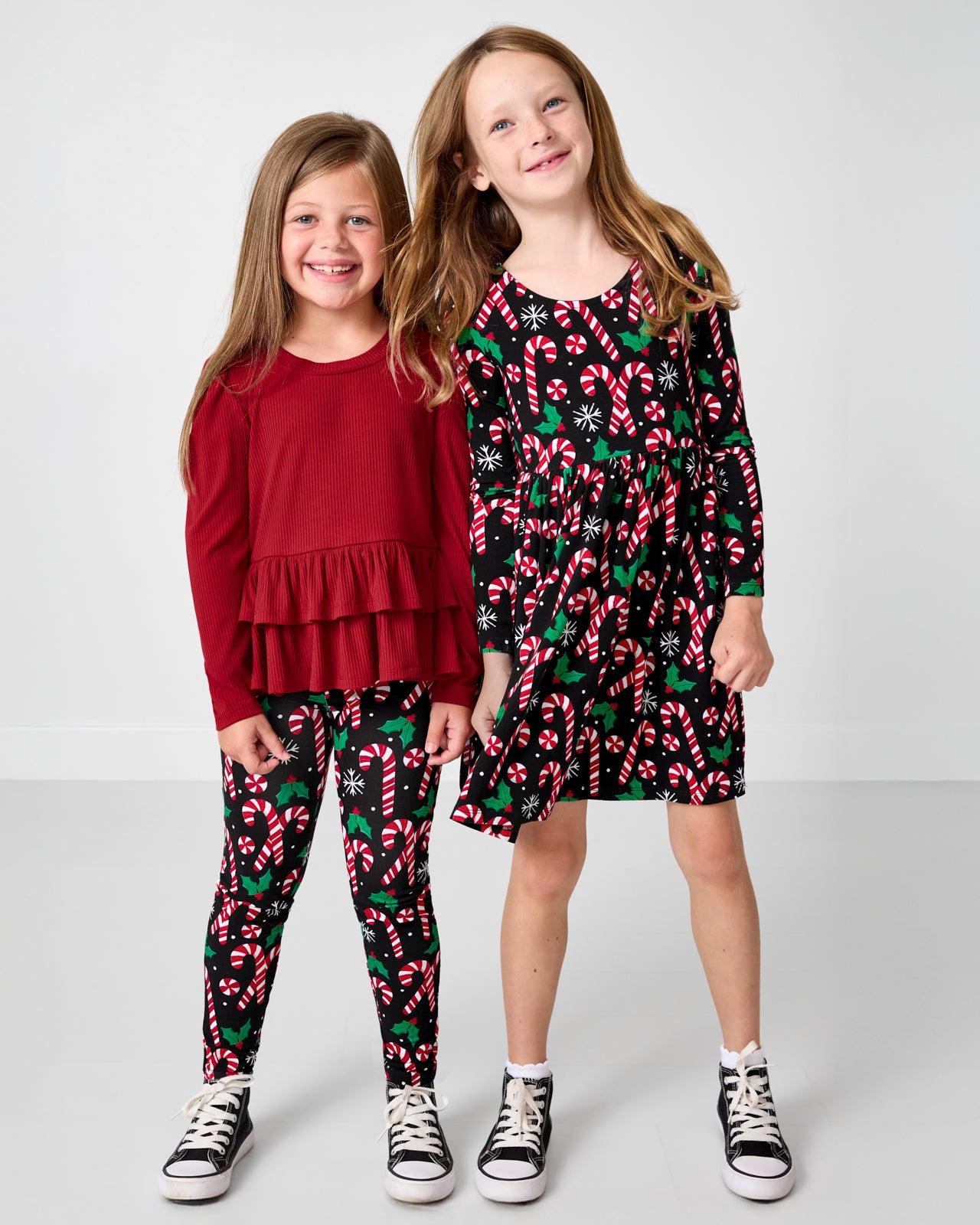 Two girls wearing matching Merry Mints print clothing