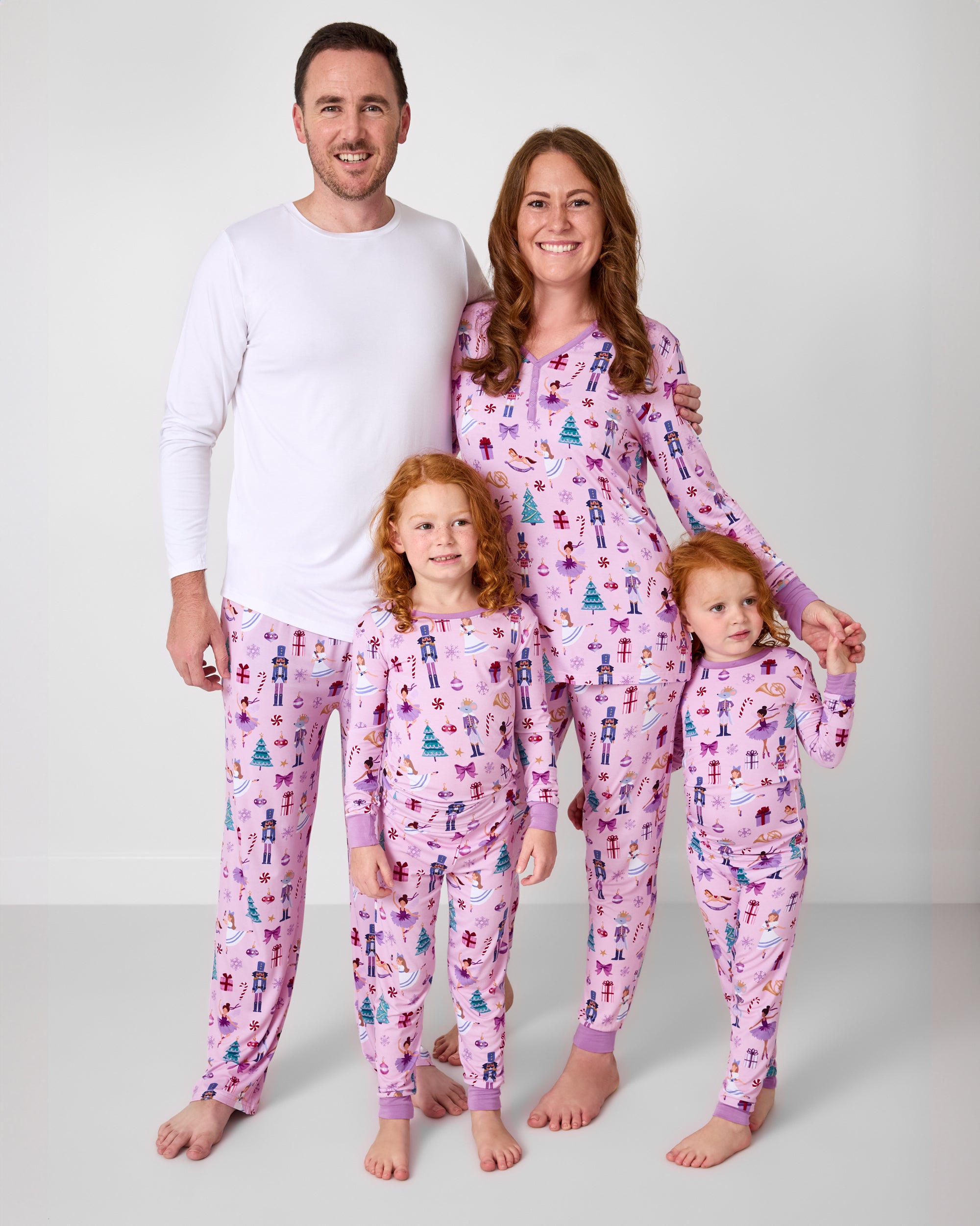 Family of four wearing the Nutcracker Ballet holiday pajamas