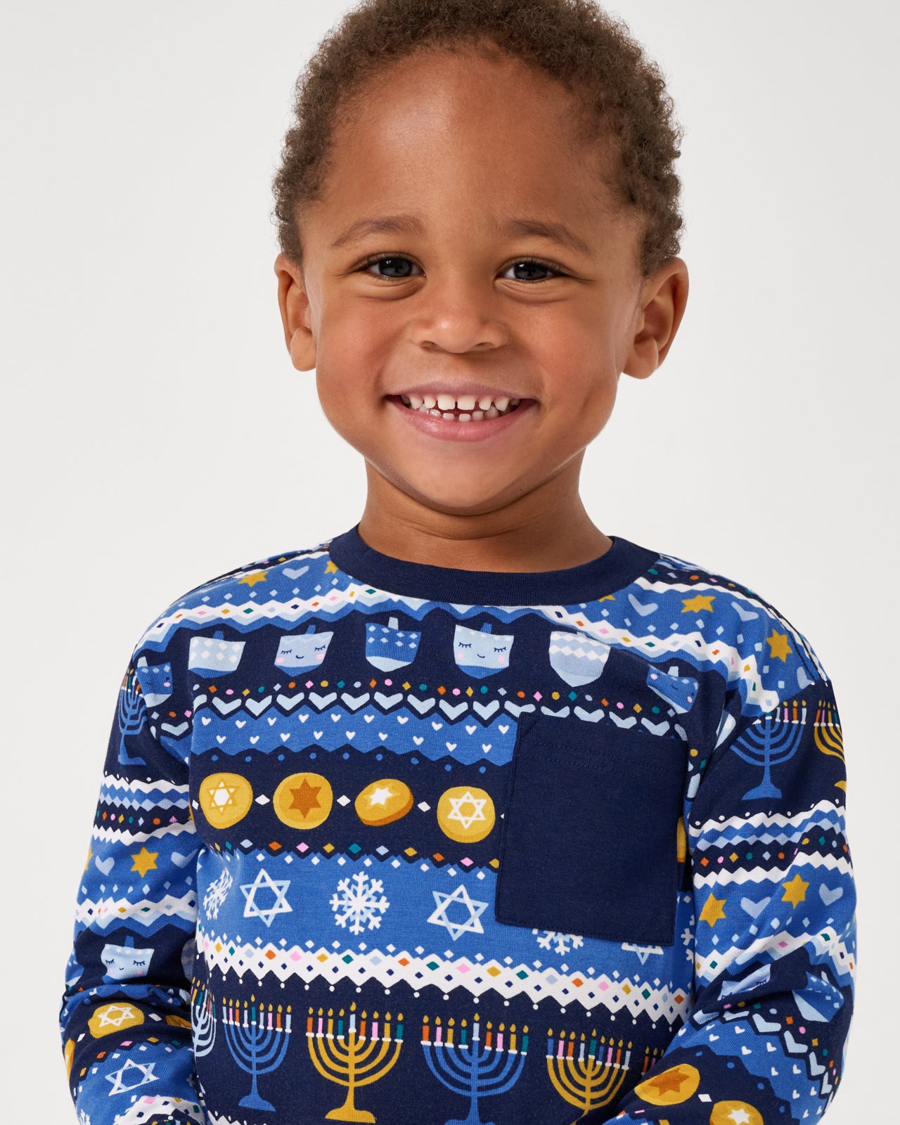 Close up of boy wearing the Hanukkah Fair Isle Relaxed Pocket Tee