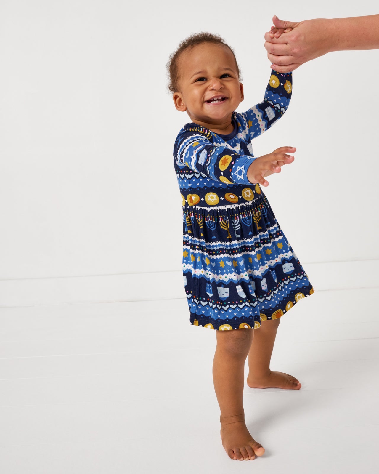 Alternate of standing baby wearing the Hanukkah Fair Isle Skater Dress with Bodysuit