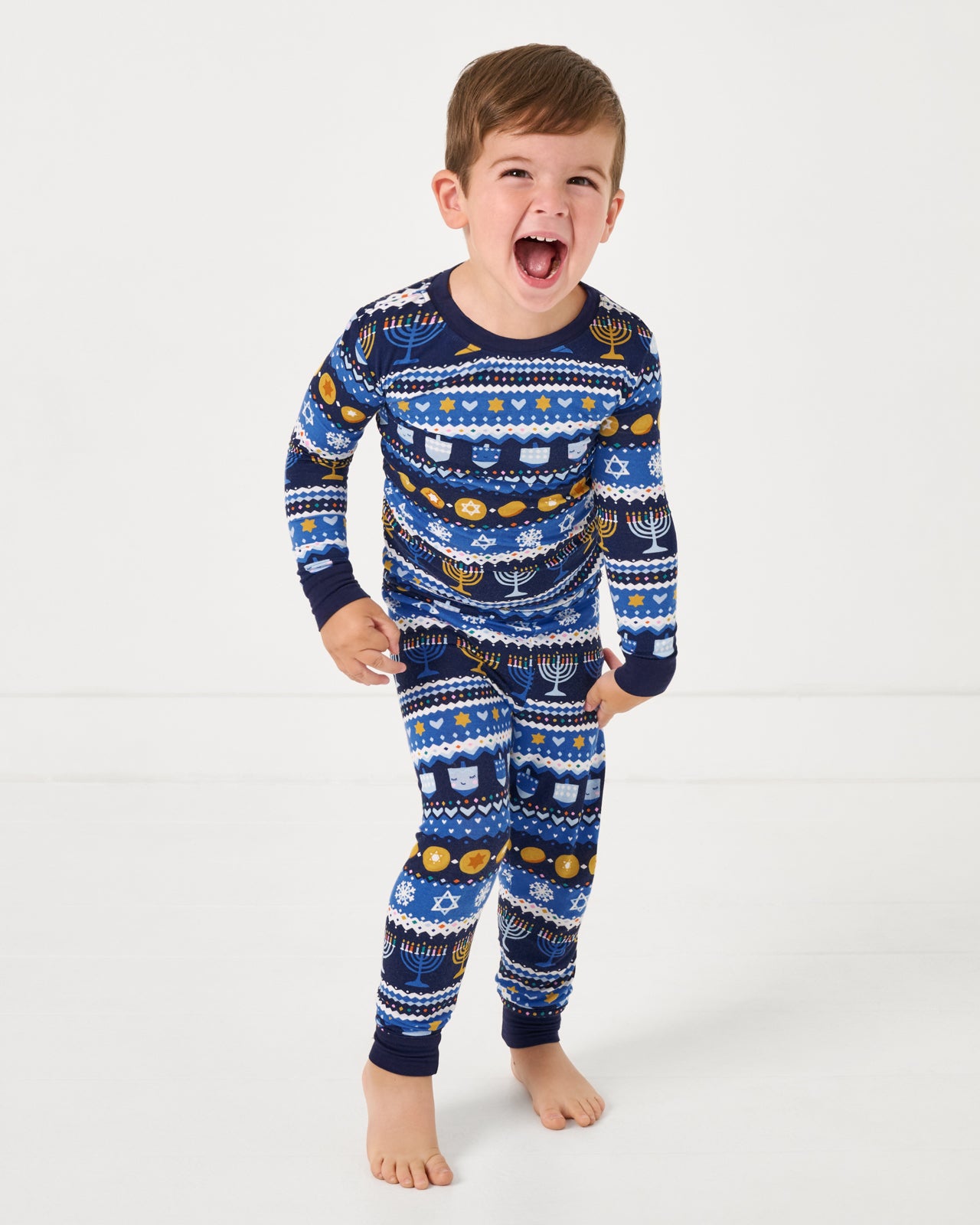 Boy wearing the Hanukkah Fair Isle Two-Piece Pajama Set