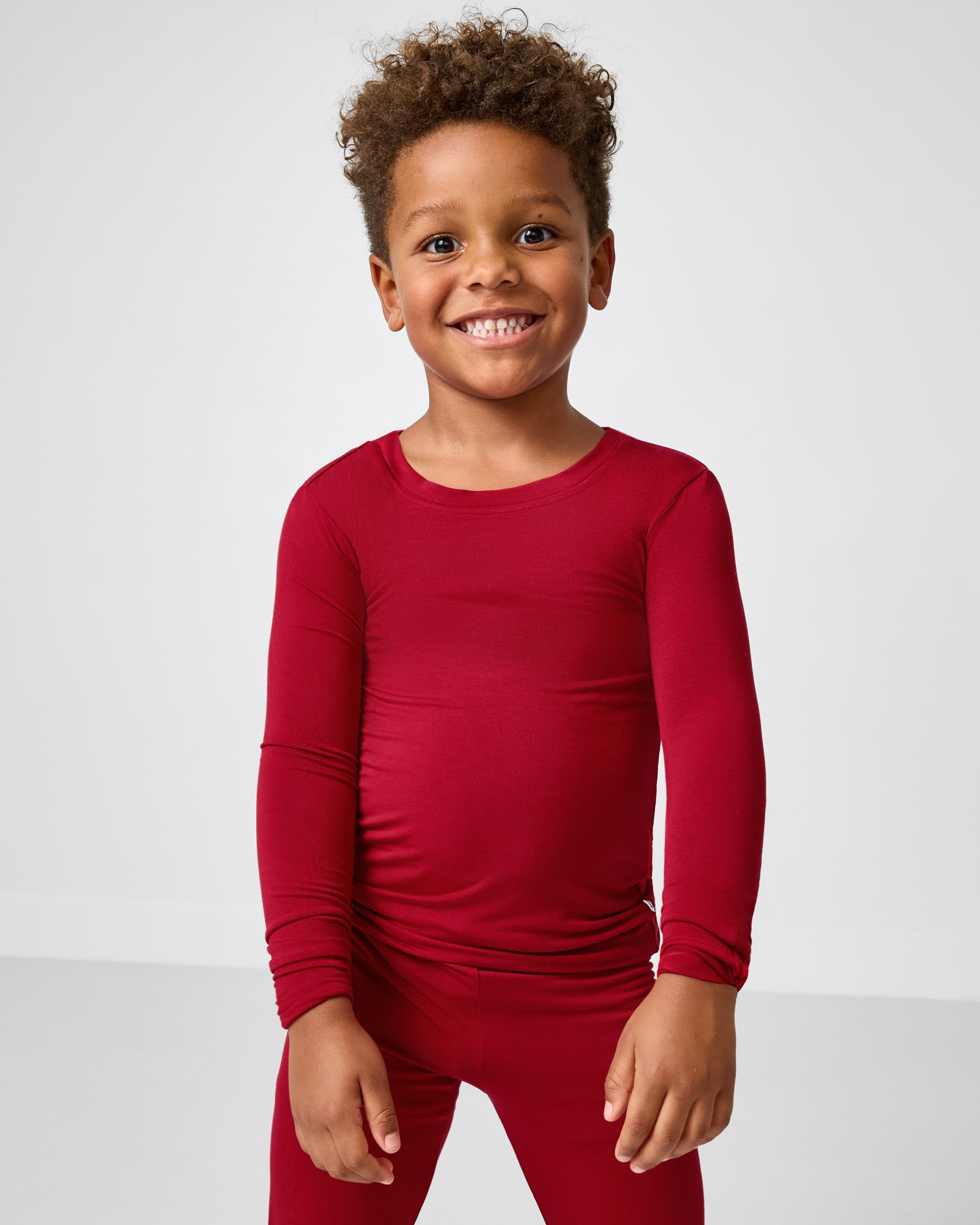 Boy wearing the Holiday Red Two-Piece Pajama Set