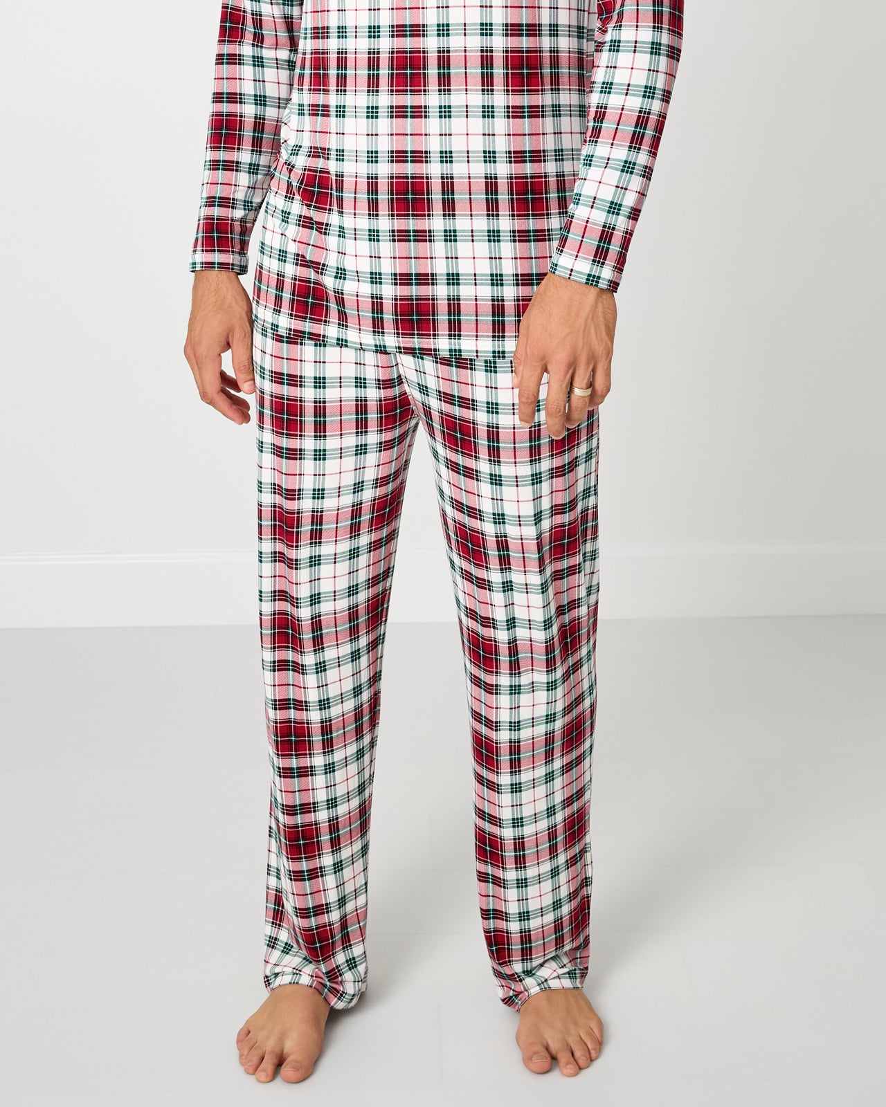 Man wearing the Holly Plaid Men's Pajama Pants with a matching pajama top