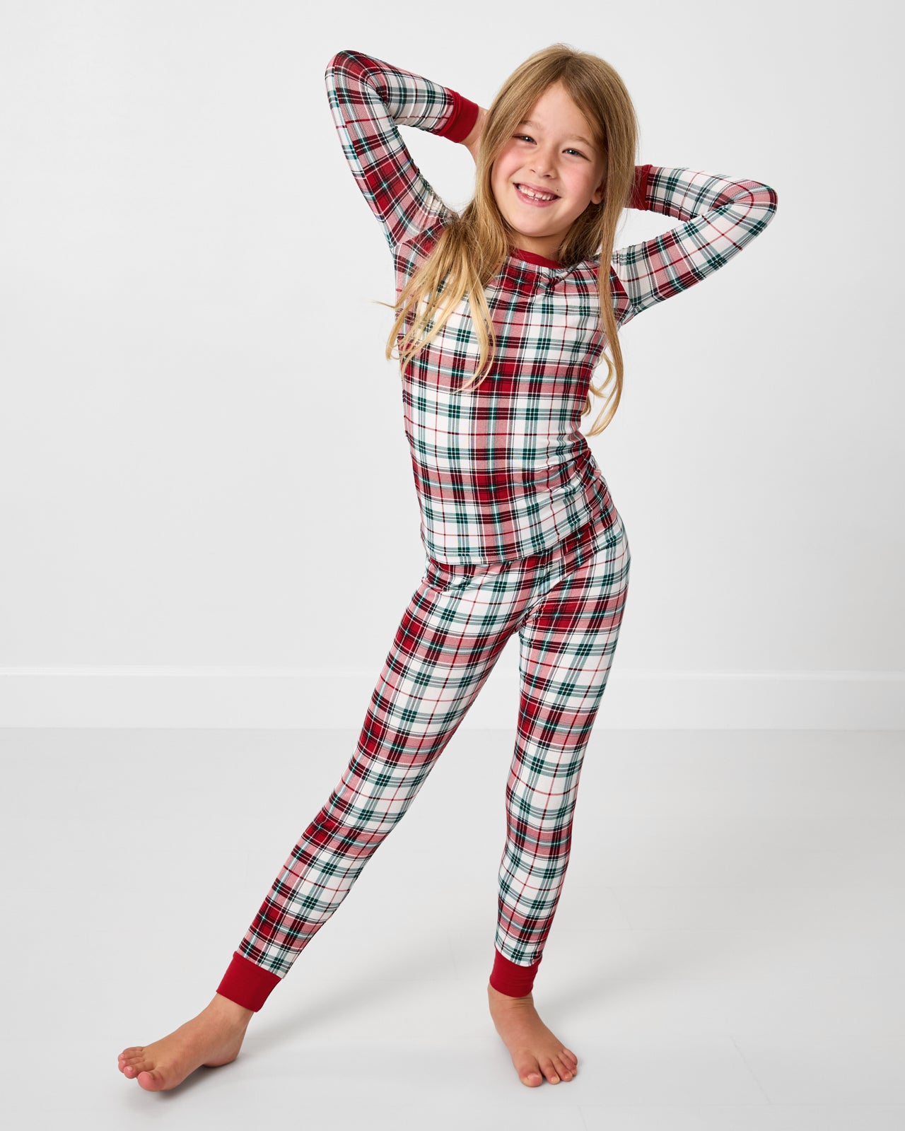 Posing girl wearing the Holly Plaid Two-Piece Pajama Set