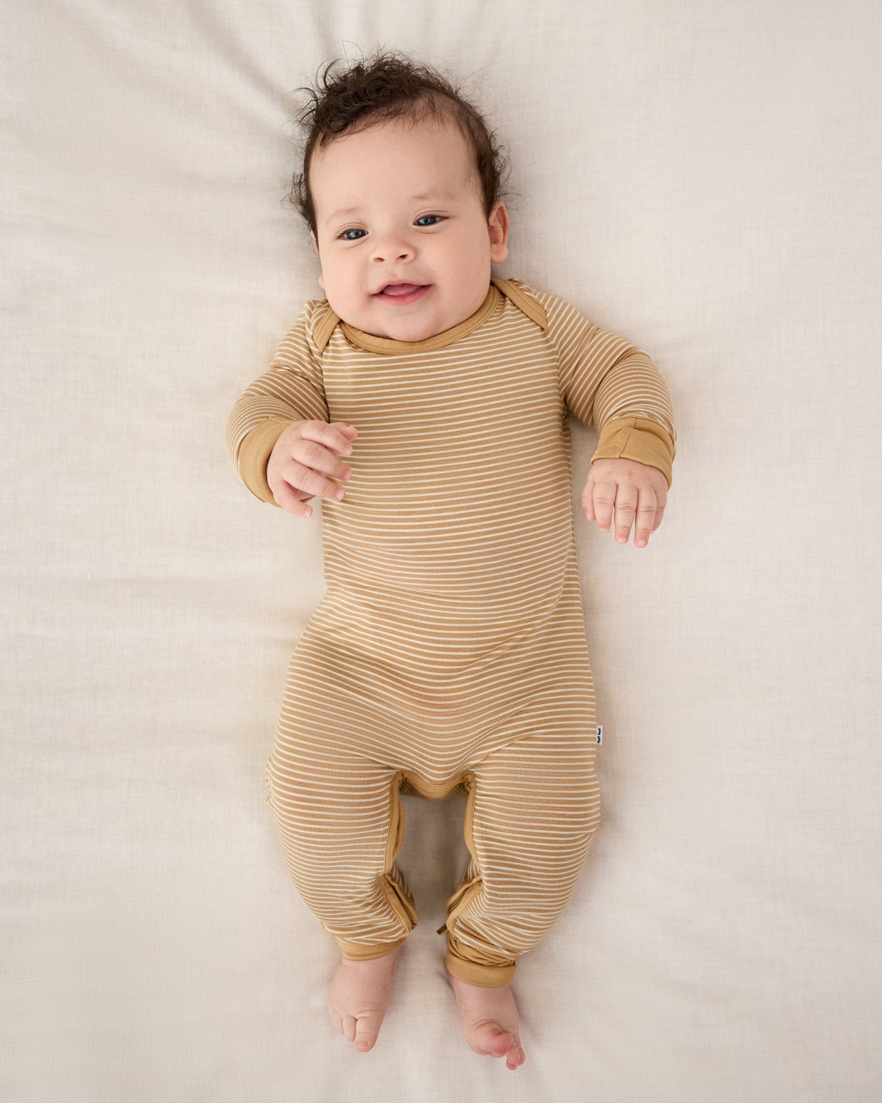 Aerial view of baby wearing the Hazelwood Stripe Crescent Zippy