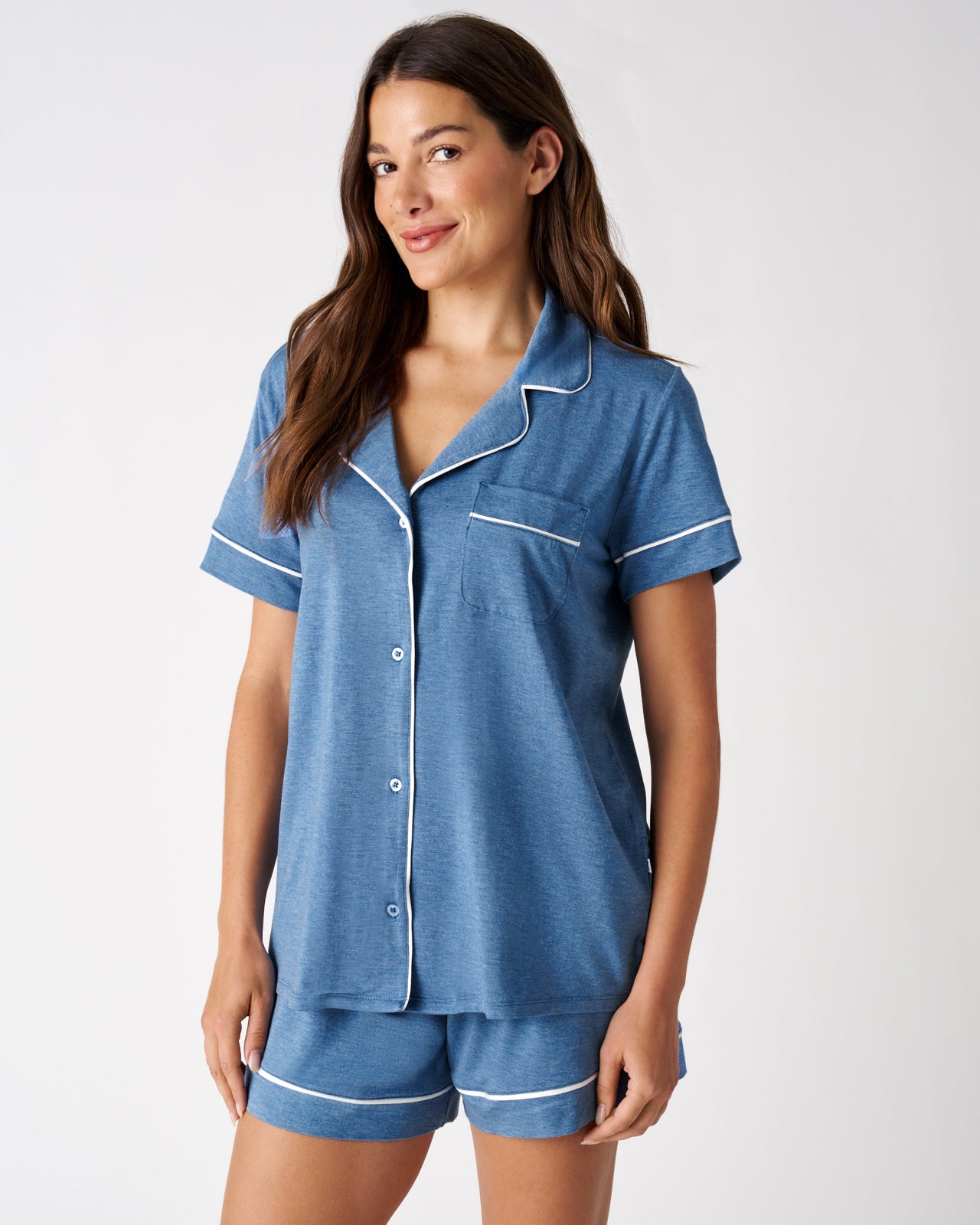 Woman wearing the Heather Blue Women's Short Sleeve & Shorts Pajama Set on a white background
