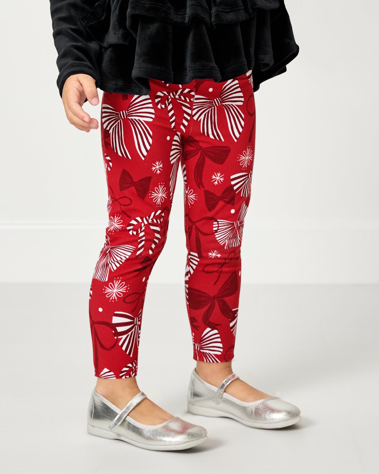 Girl wearing the Holiday Bows Legging with maryjanes