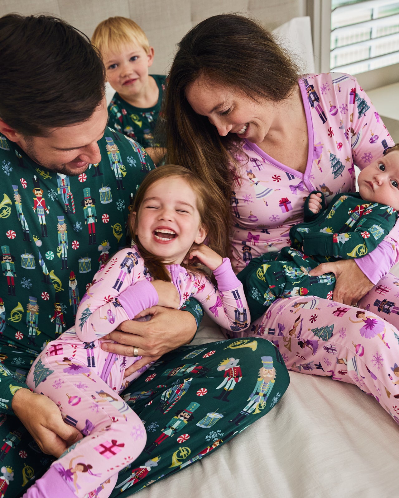 Family of five wearing Nutcracker Ballet and March pajamas