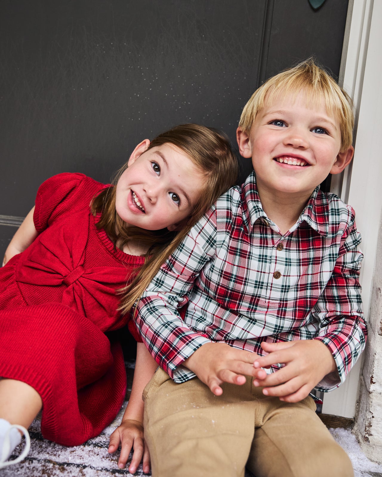 Two kids wearing styles from the Holiday Collection