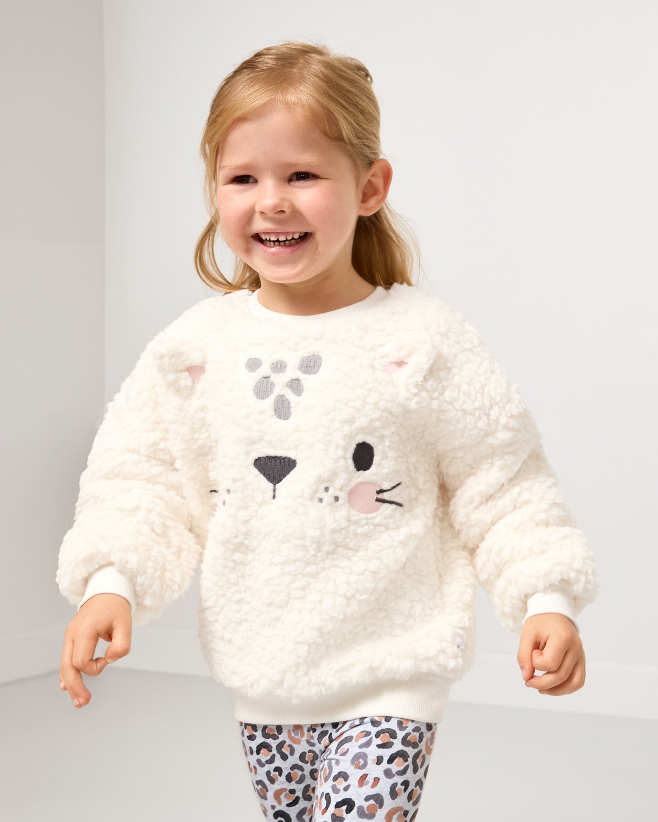 Girl wearing the Leopard Drop Shoulder Crewneck