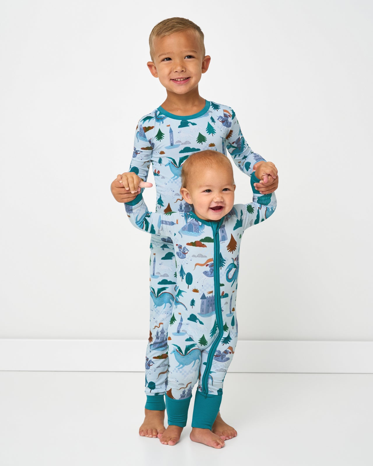 Two children wearing matching Knight's Quest bamboo pajamas