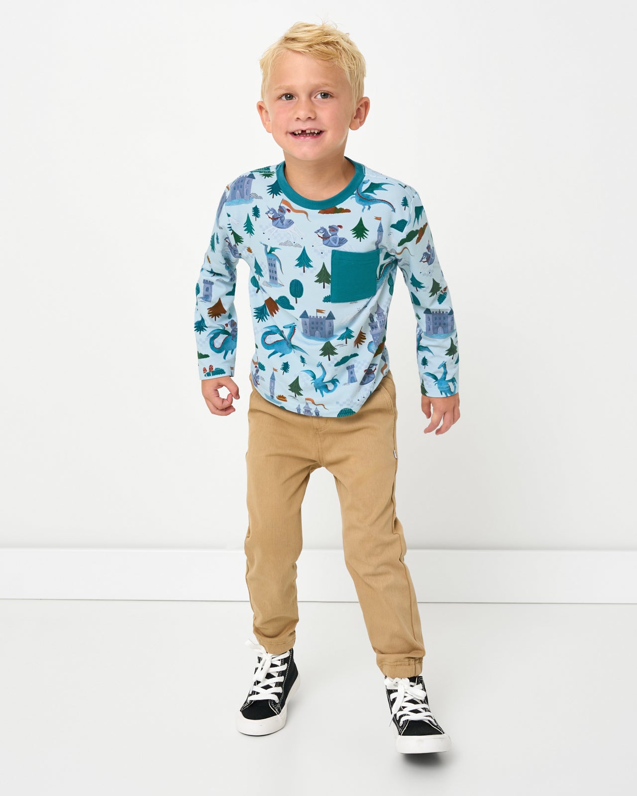 Boy wearing the Knight's Quest Relaxed Pocket Tee with khaki joggers