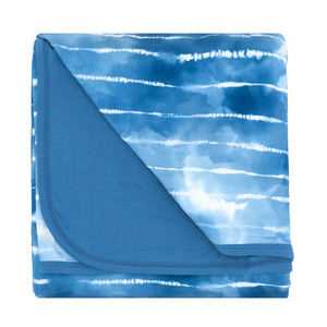 Flat lay image of a Blue Tie Dye Dreams large cloud blanket