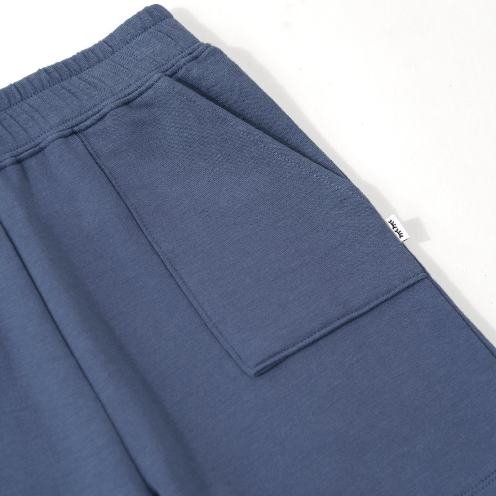 Close up image of the pocket detail on the Vintage Navy Shorts