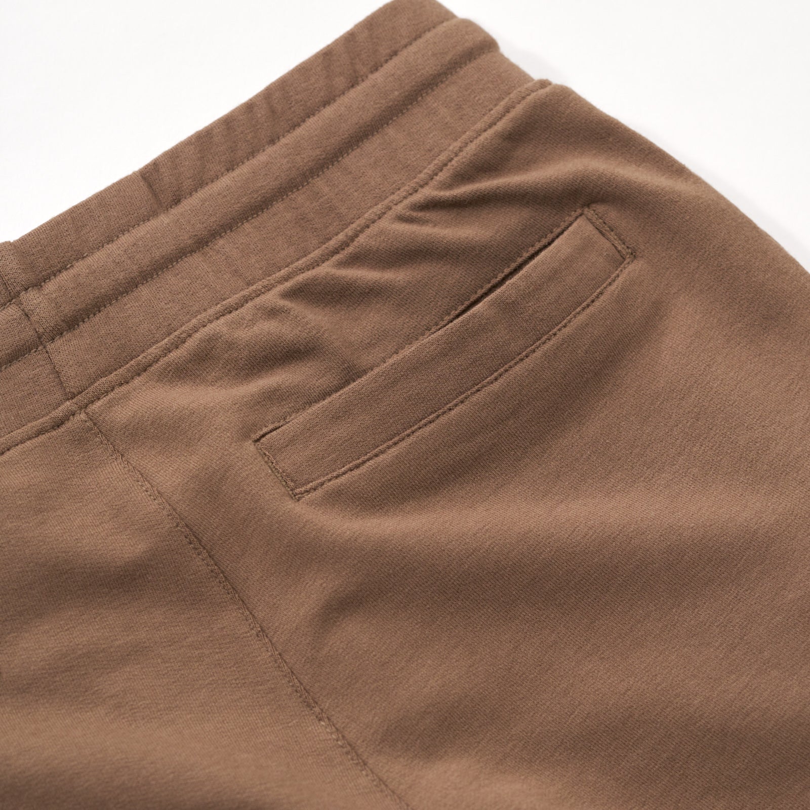Close up flat lay image of the back pocket detail on the Vintage Brown Cargo Shorts