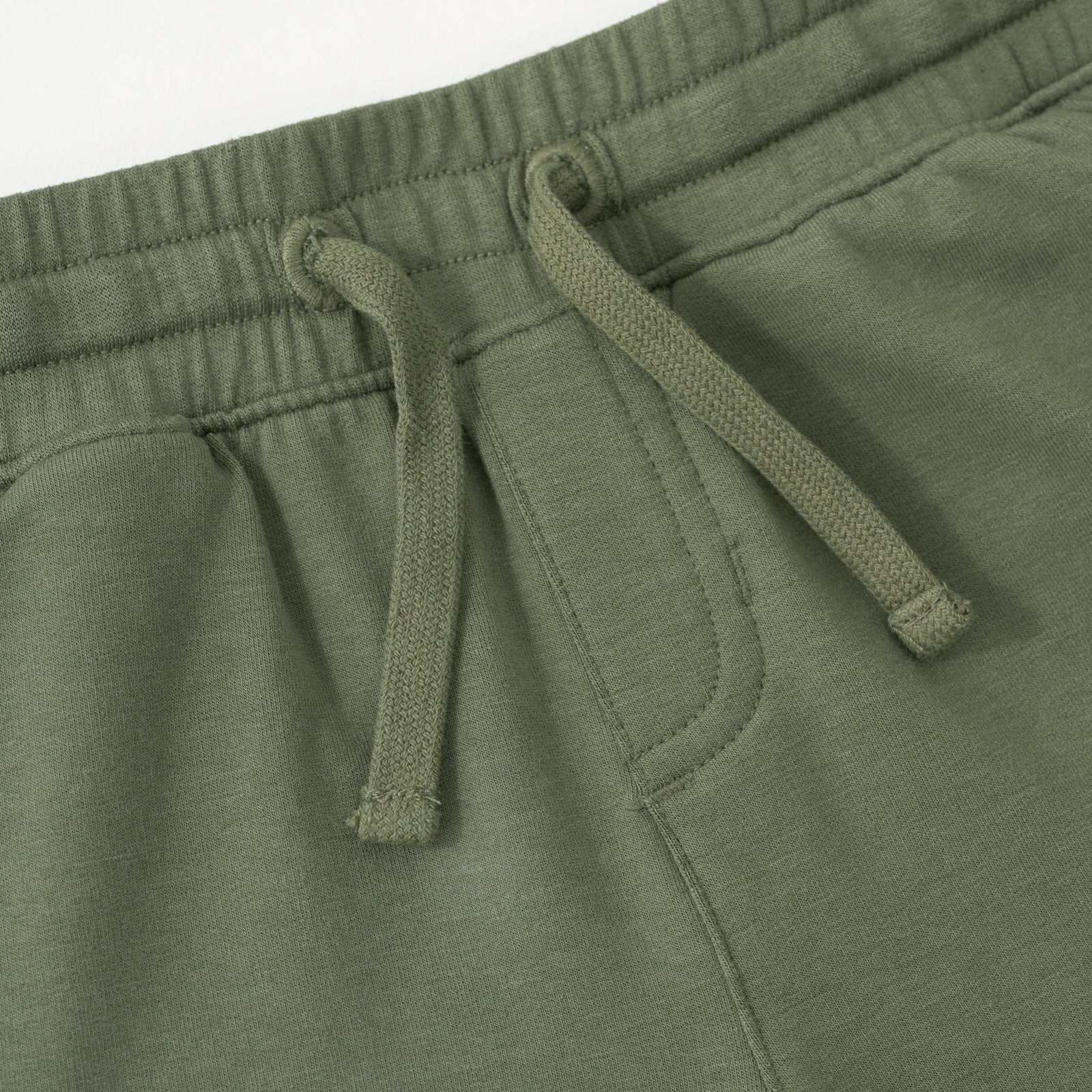 Close up flat lay image of the drawstring waist on the Olive Cargo Shorts