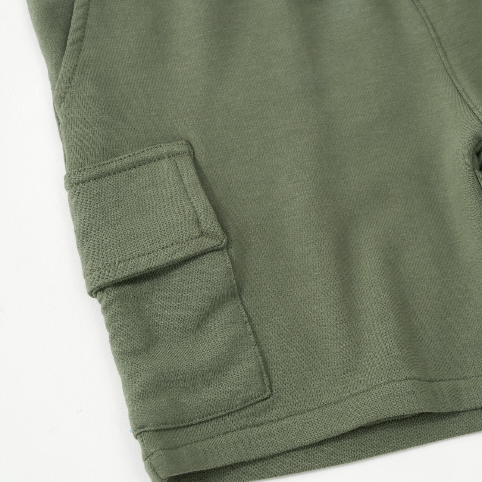 Close up flat image image of the cargo pocket on the Olive Cargo Shorts