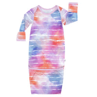 Flat lay image of a Pastel Tie Dye Dreams infant gown