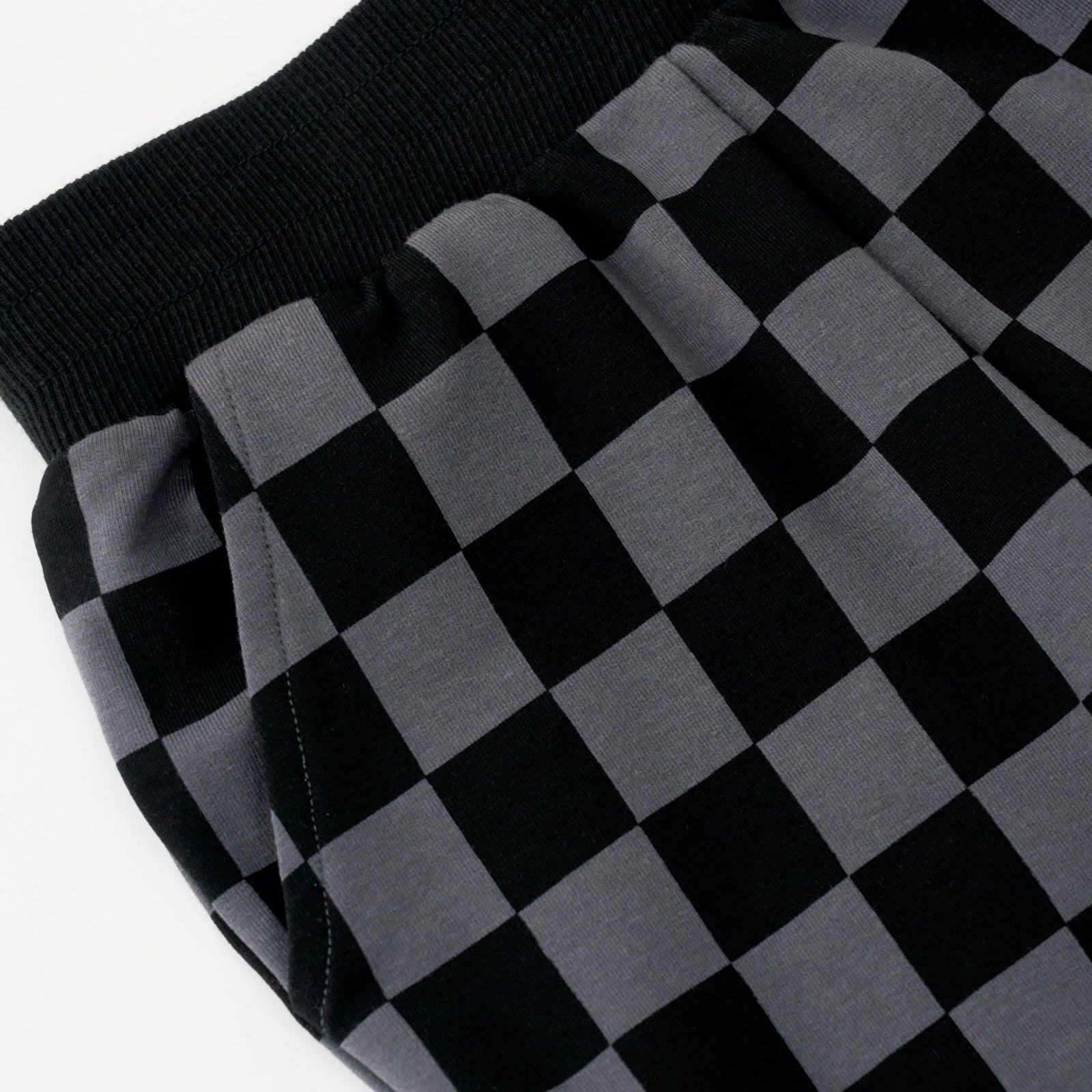 Close up flat lay of the waist and pocket detail on the Monochrome Checks Joggers