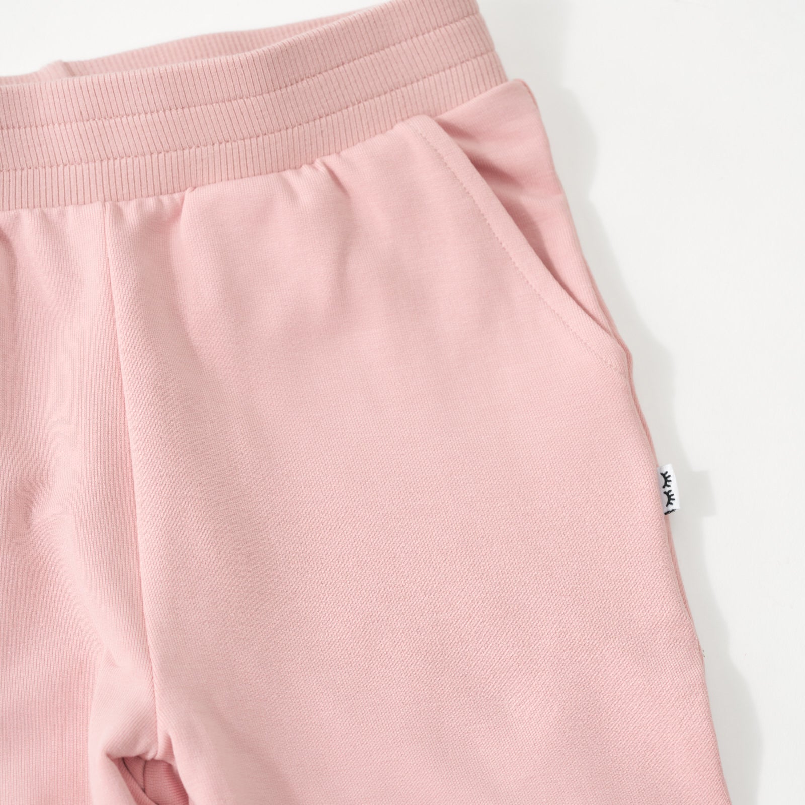 Close up of the waist and pocket detail on the Mauve Blush Jogger