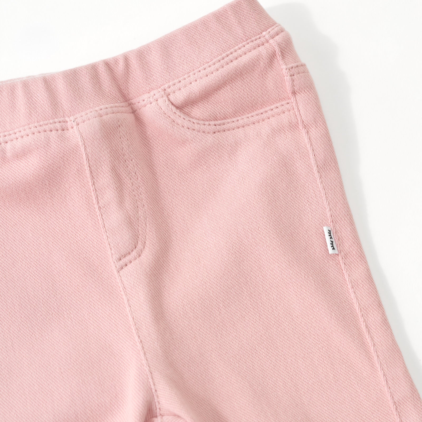 Close up flat lay of the pocket detail on the Mauve Blush Denim Legging