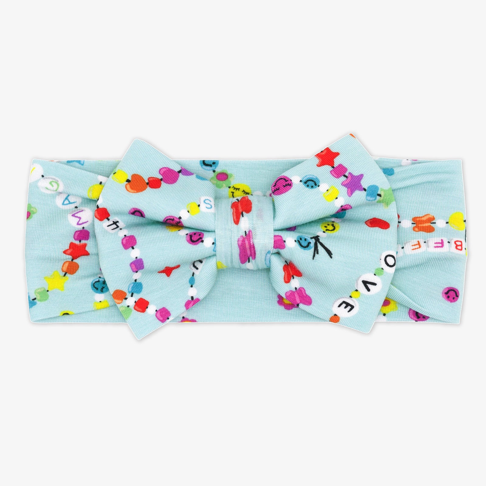 Flat lay of the Forever Friends luxe bow headband