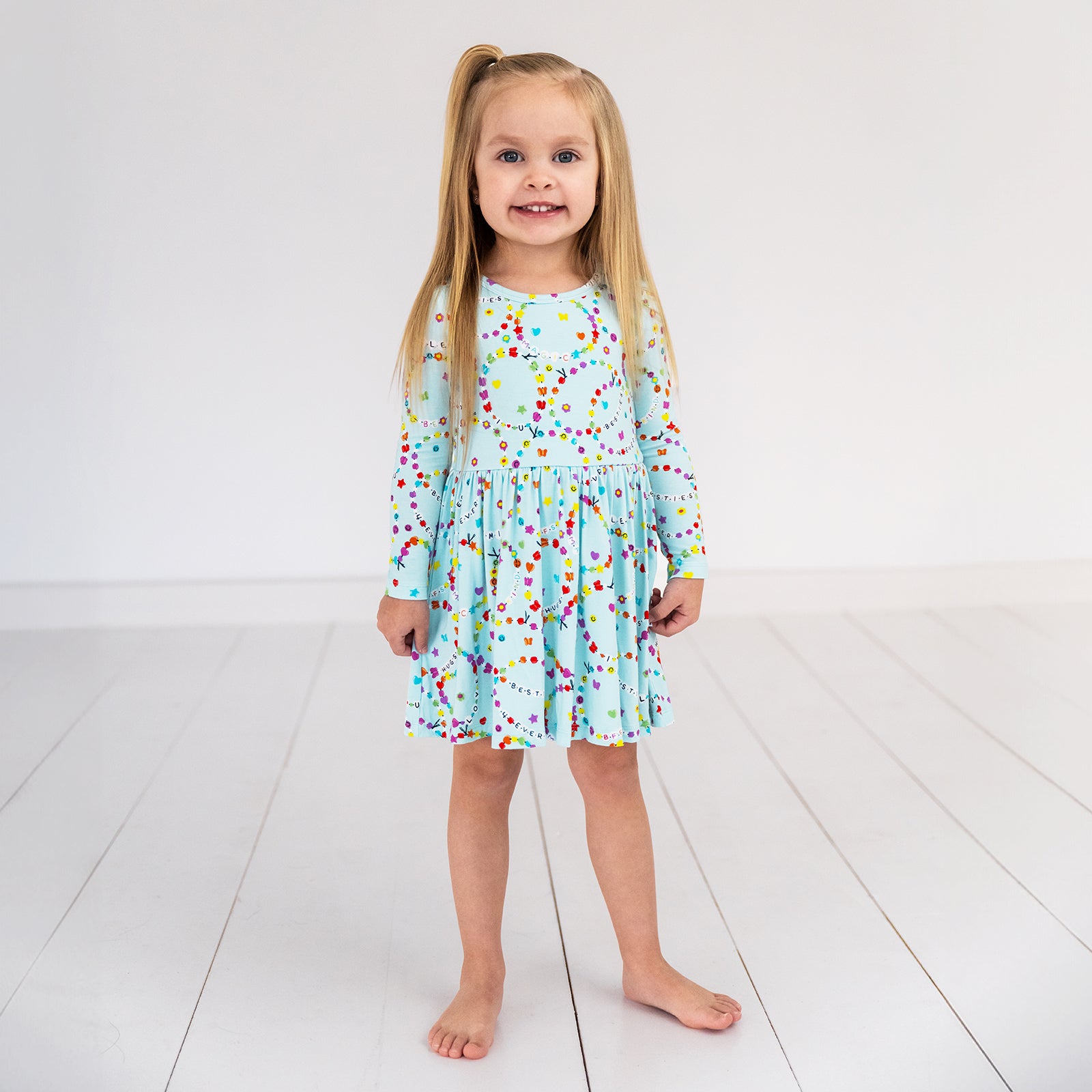 child wearing a friends forever twirl dress with bodysuit