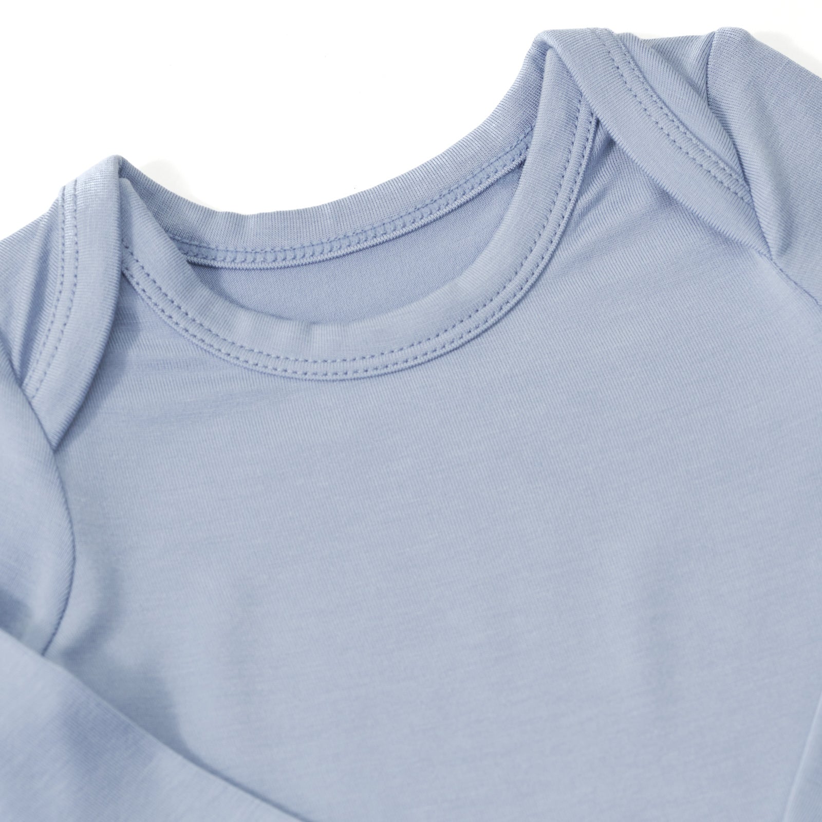 Close up image of the shoulder details on the Fog Bodysuit