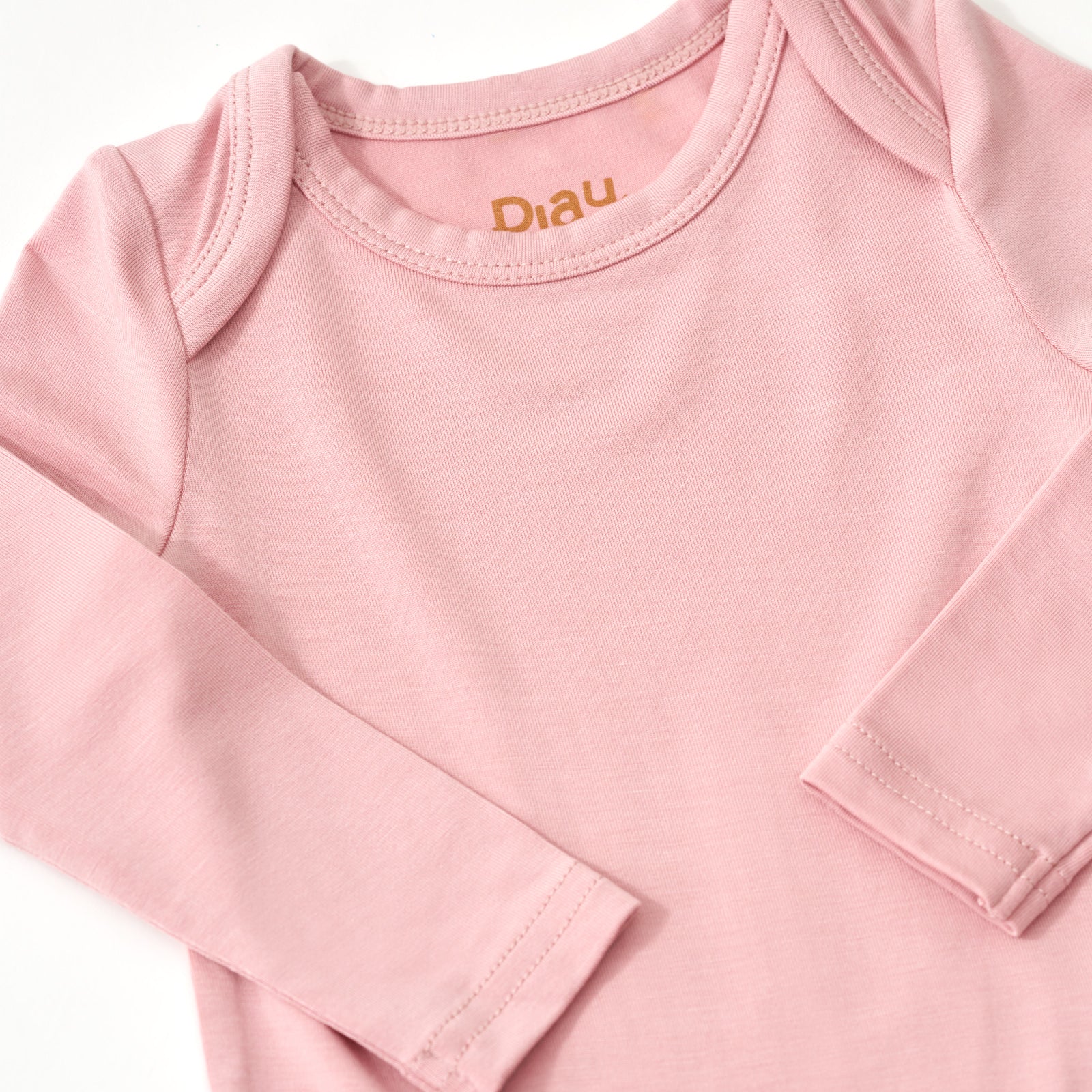 Close up of should and arm details for the Mauve Blush Bodysuit