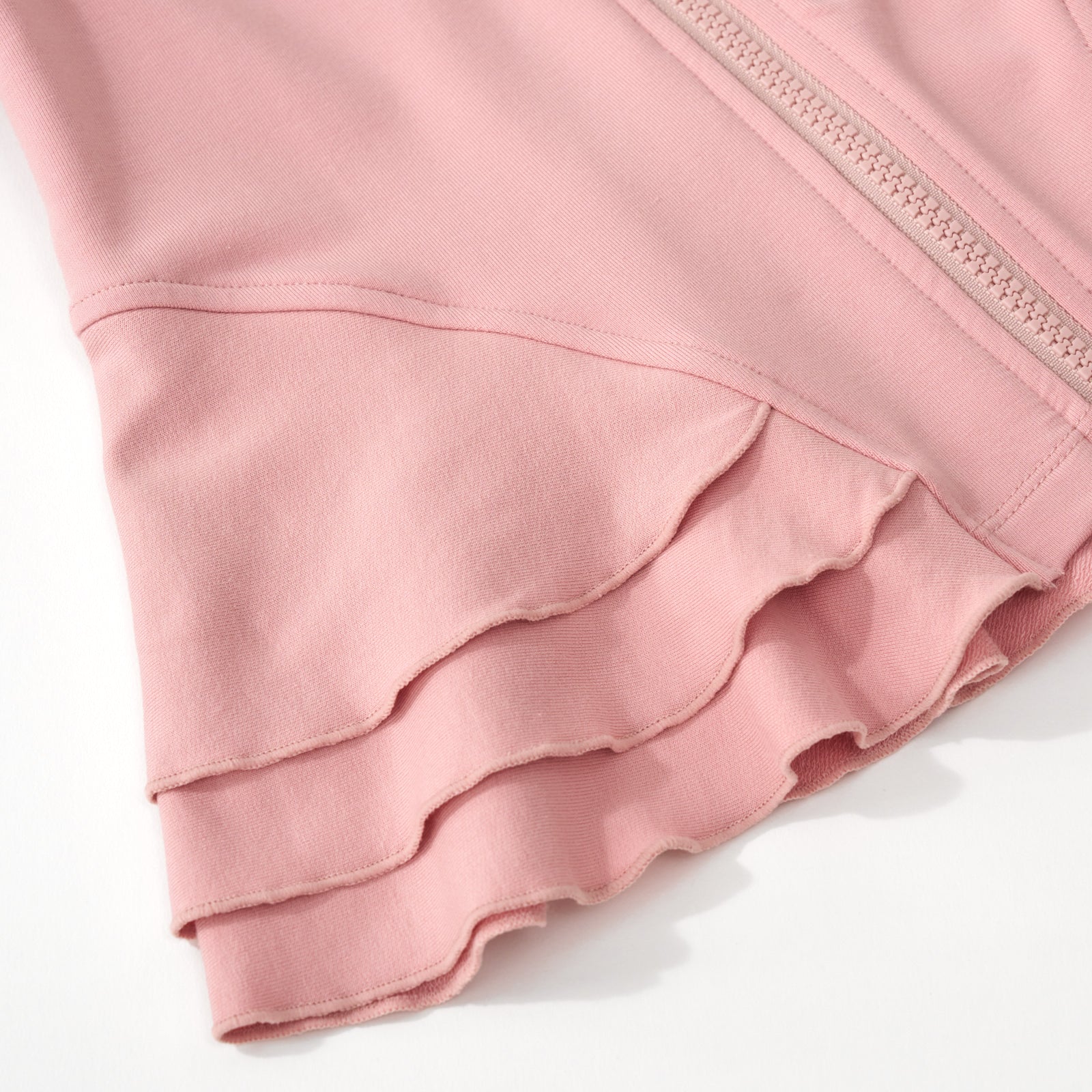 Close up of the peplum detail for the Mauve Blush Peplum Hoodie