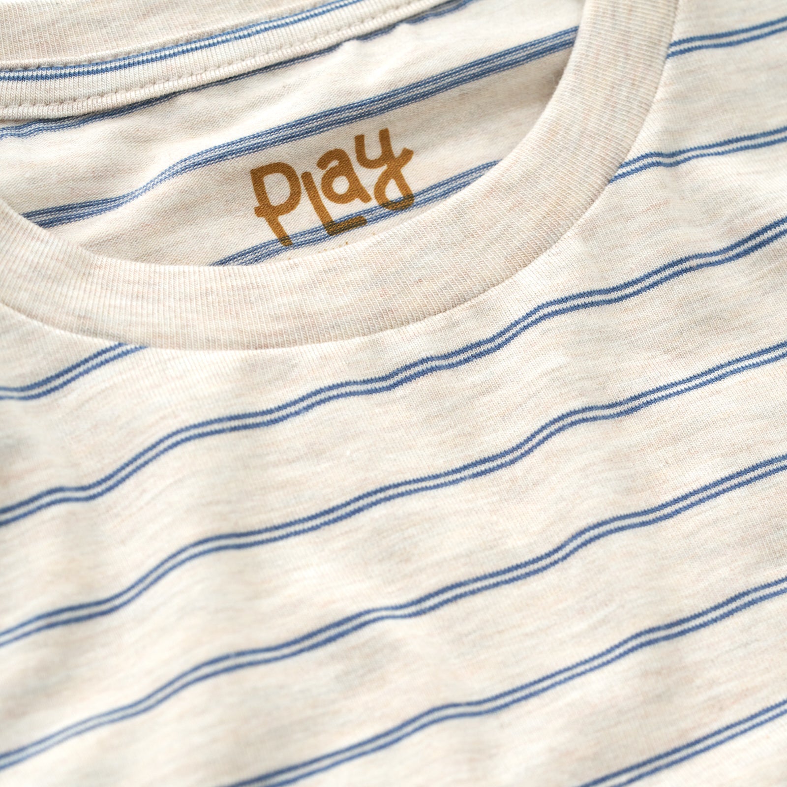 Close up of the collar detail on the Stone Stripes Relaxed Tee