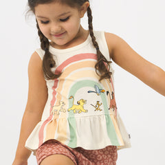Close up image of a child wearing a Lion King graphic peplum tank and coordinating Play shorts