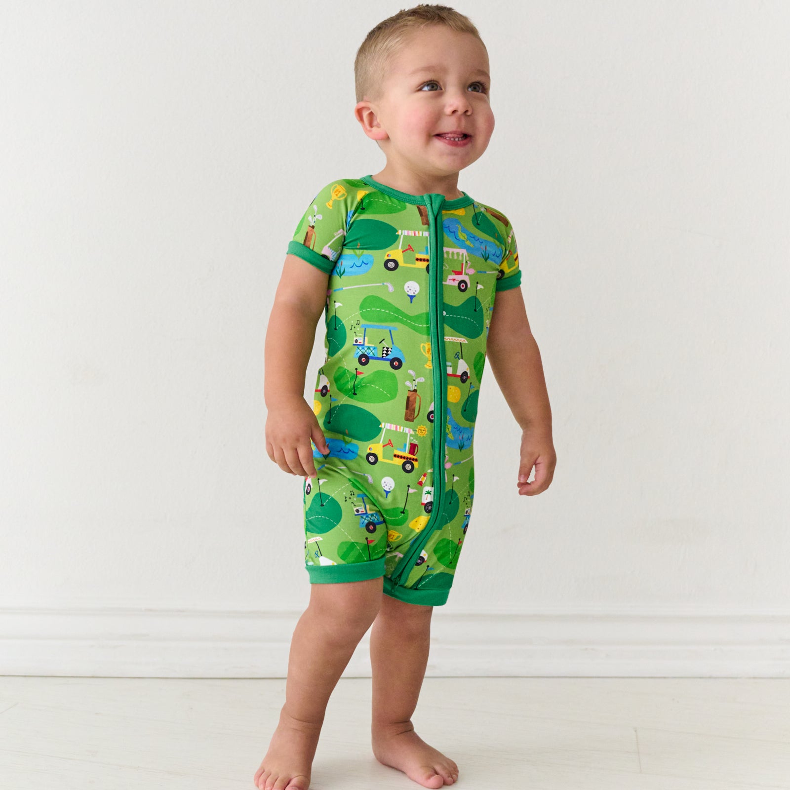 Child wearing a Fairway Fun shorty zippy