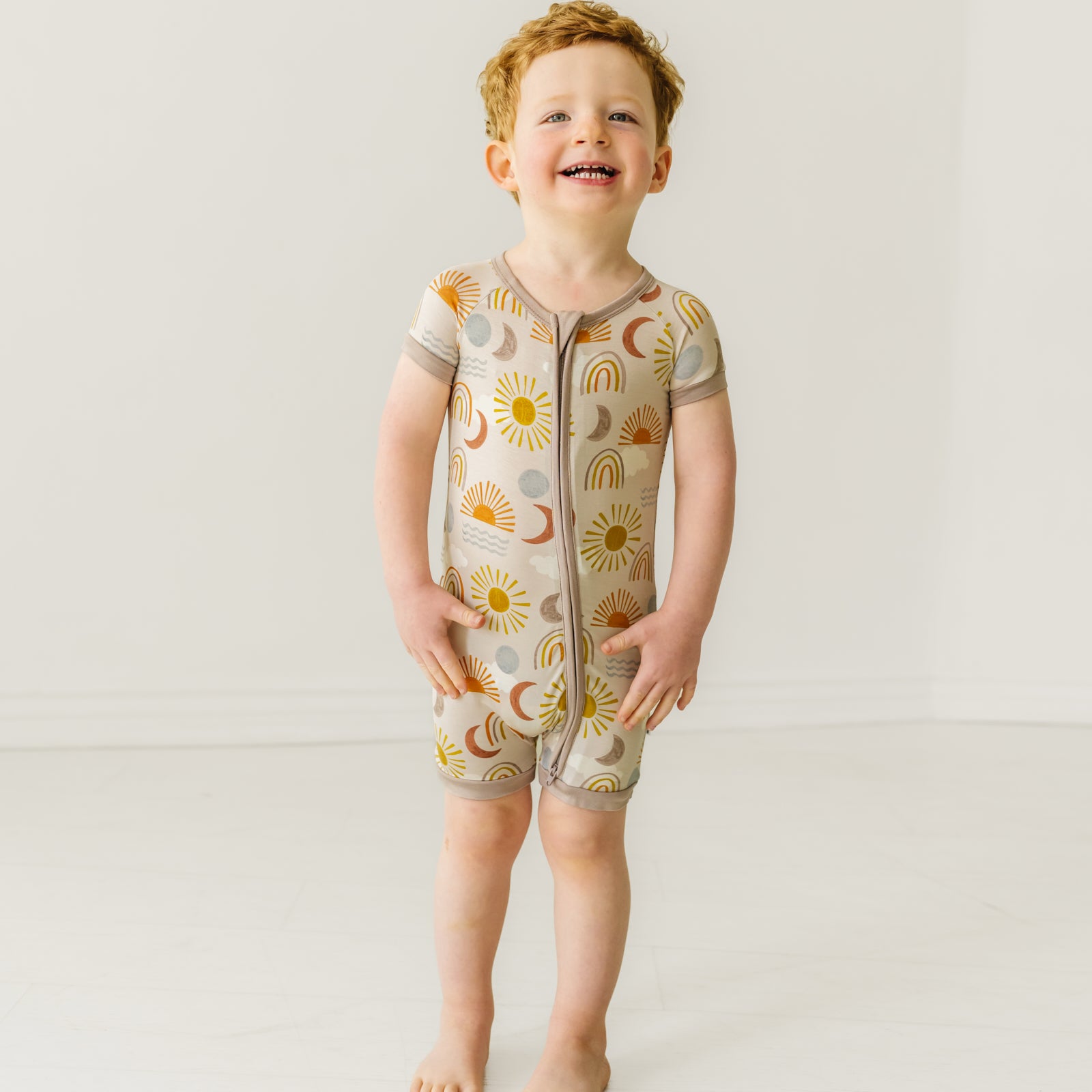 Child wearing a Desert Sunrise shorty zippy